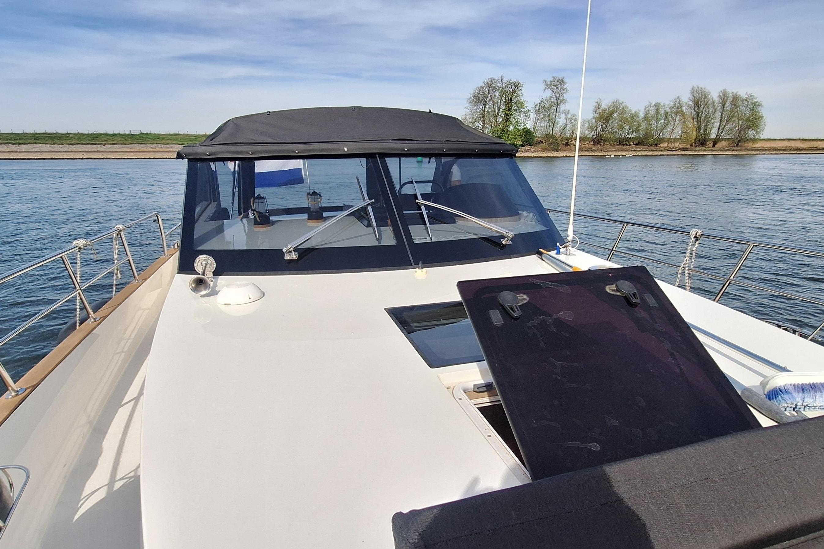 2023 Antaris X boat on calm water, featuring sleek design and spacious deck.