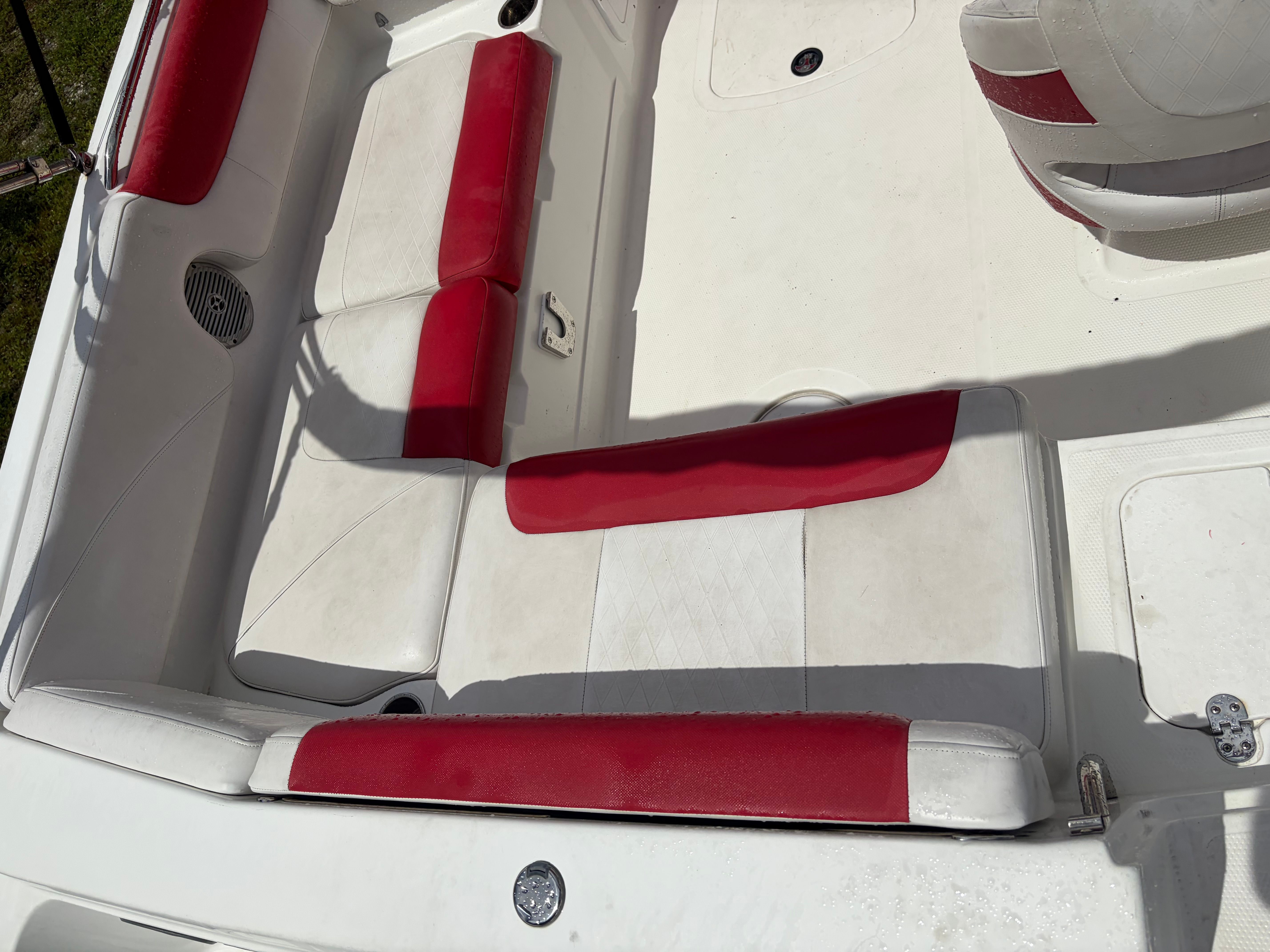 Interior view of a 2019 Tahoe 21.5 with red and white seating.