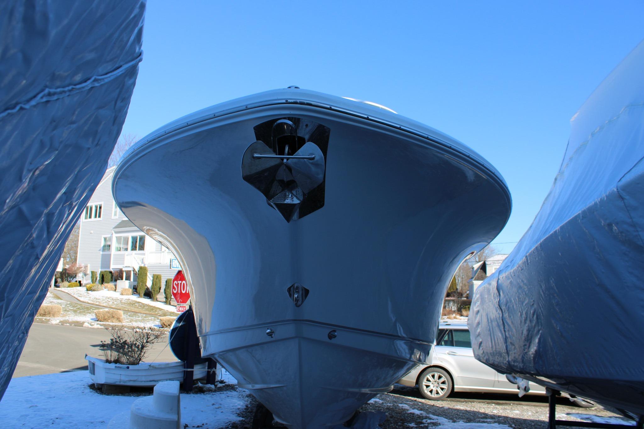2026 Sea Hunt Gamefish 25 boat, front view, parked outdoors on a sunny day.
