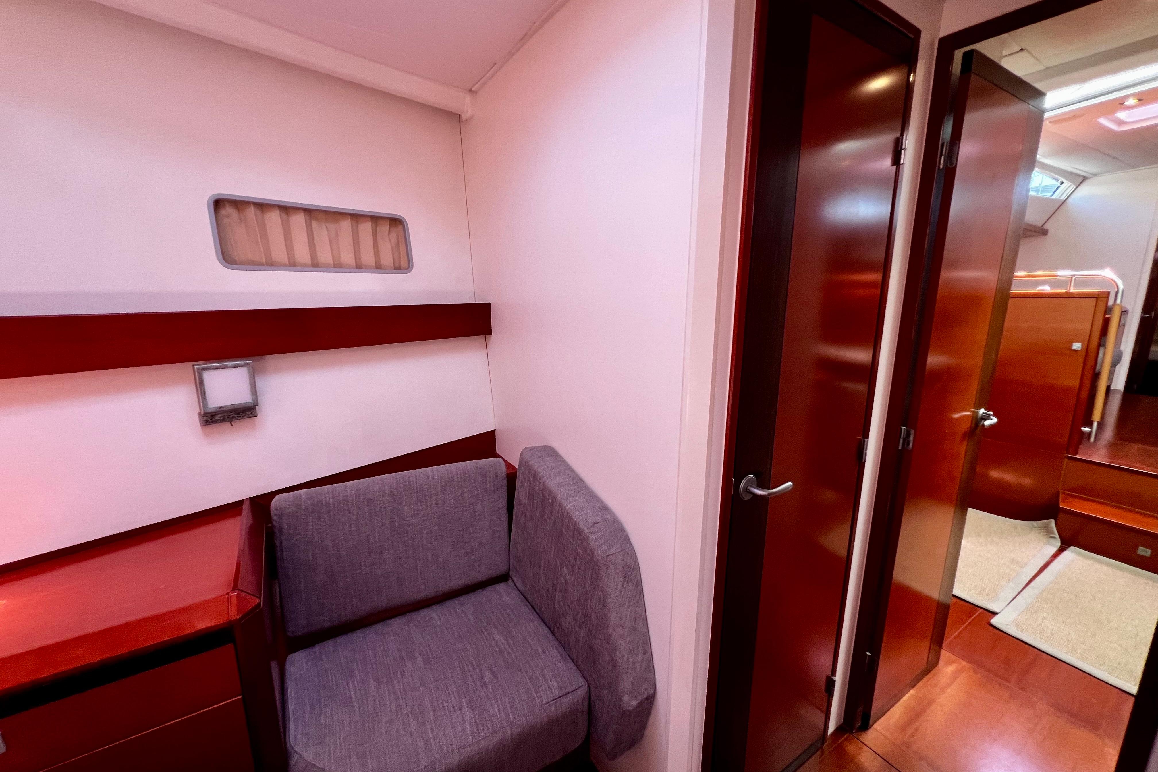 Luxurious interior of 2009 CNB BORDEAUX 60 yacht with modern wood finishes and cozy seating.