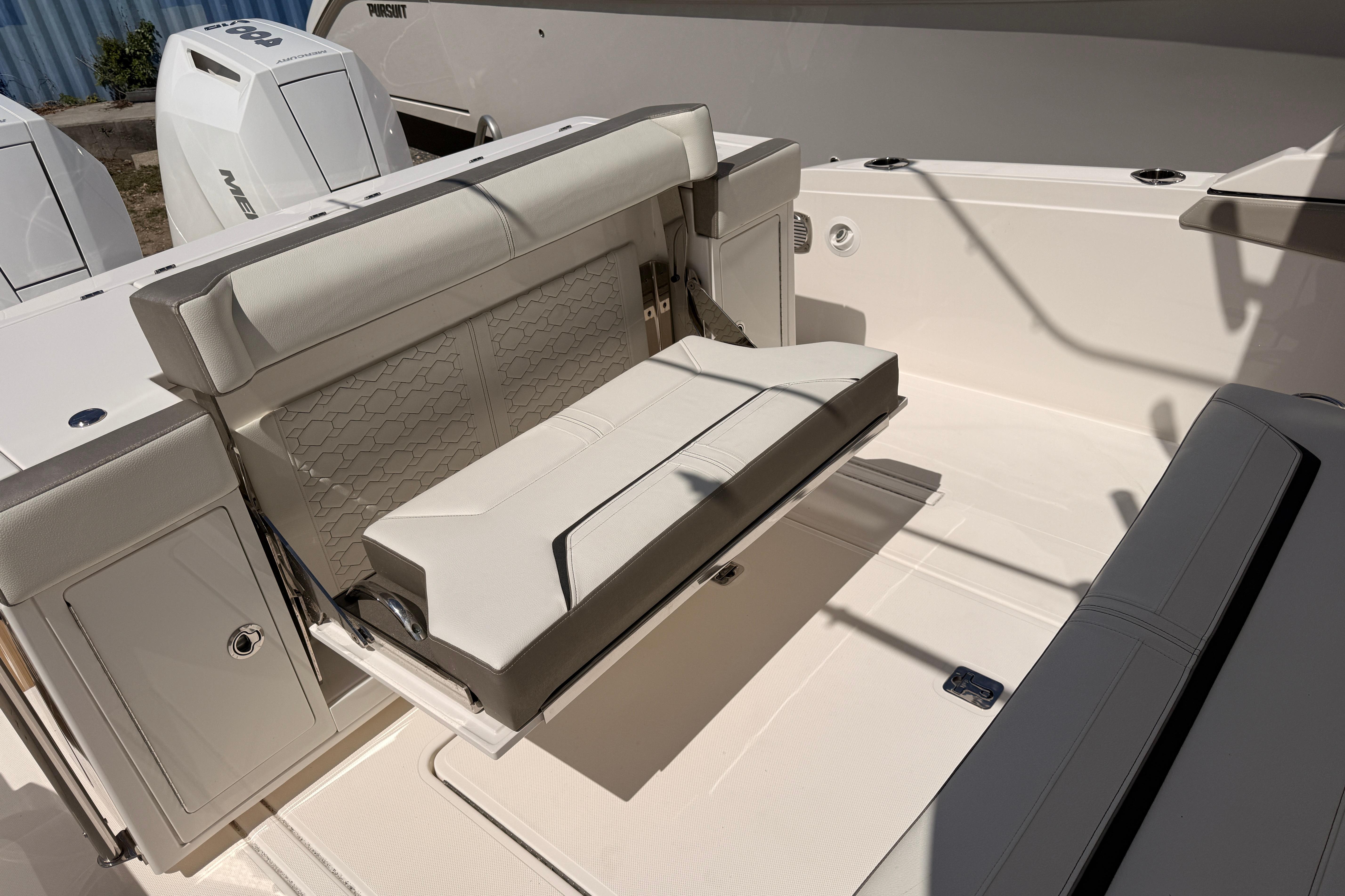 2024 Tiara Yachts 34 LS boat interior with foldable seating and modern design.