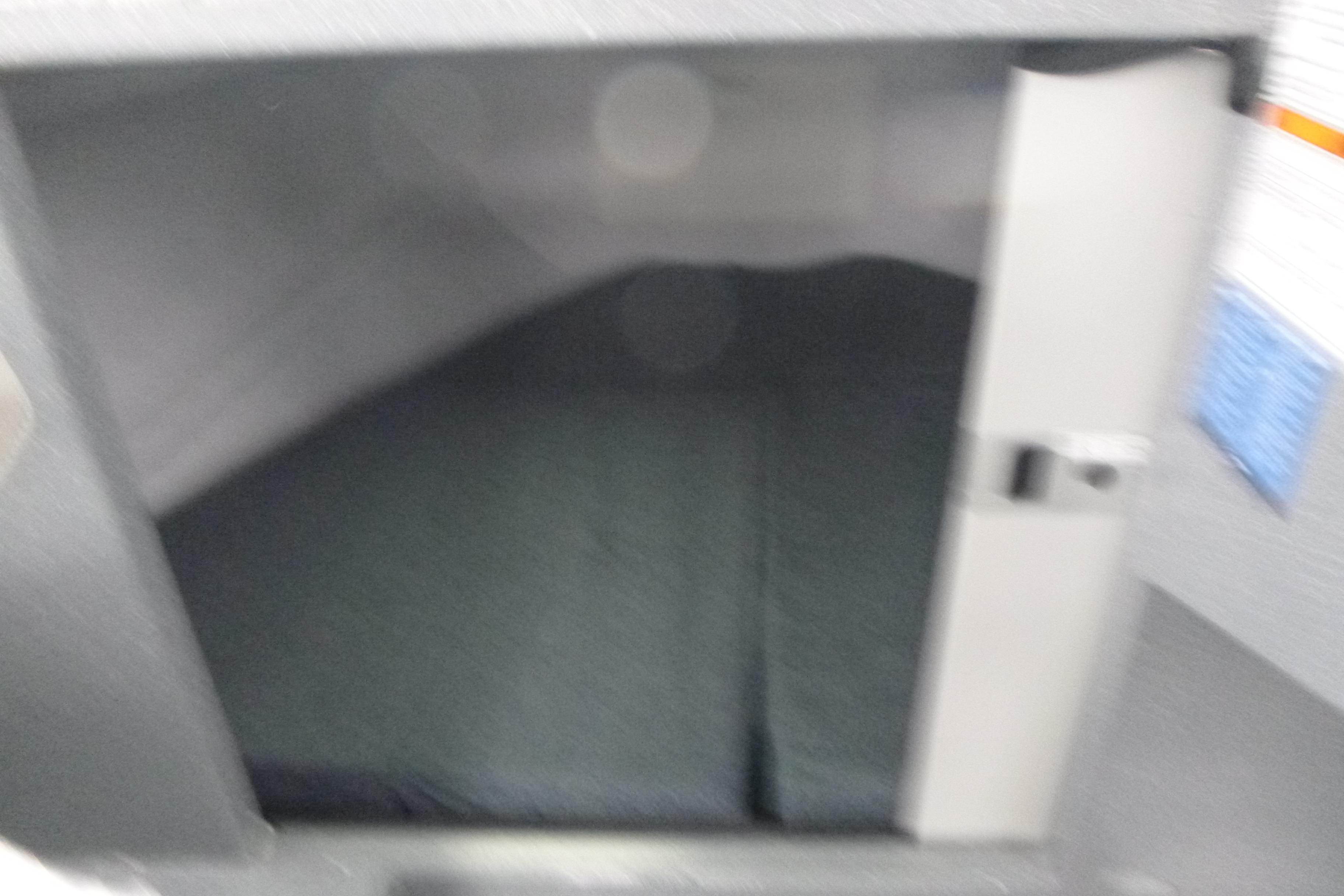 Interior cabin space of 2026 KingFisher 25 XAC boat, featuring storage compartment.