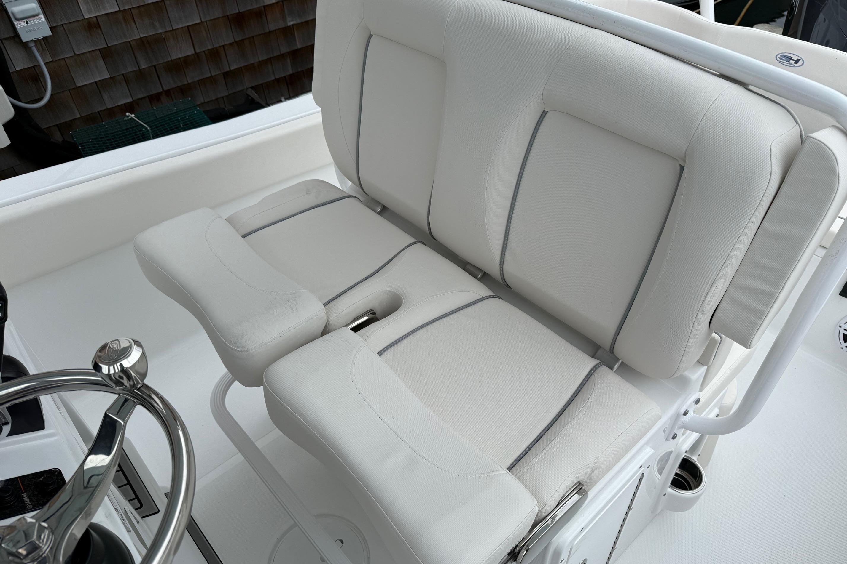 2026 Sea Hunt Ultra 235 SE boat interior with plush white seating.