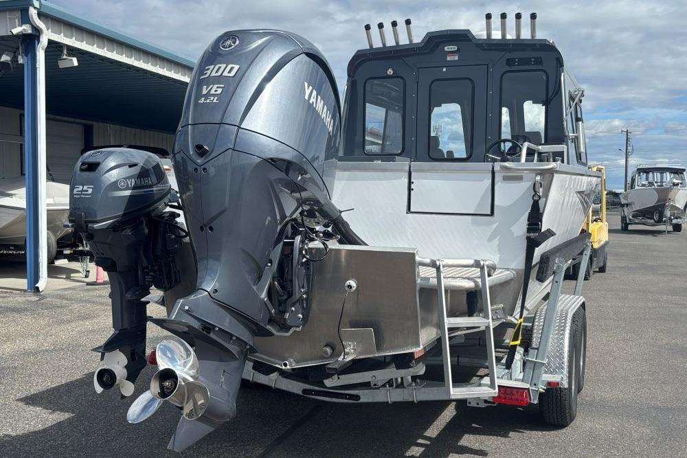 2024 Hewescraft 240 Ocean Pro Hardtop with Yamaha outboard engines on a trailer.