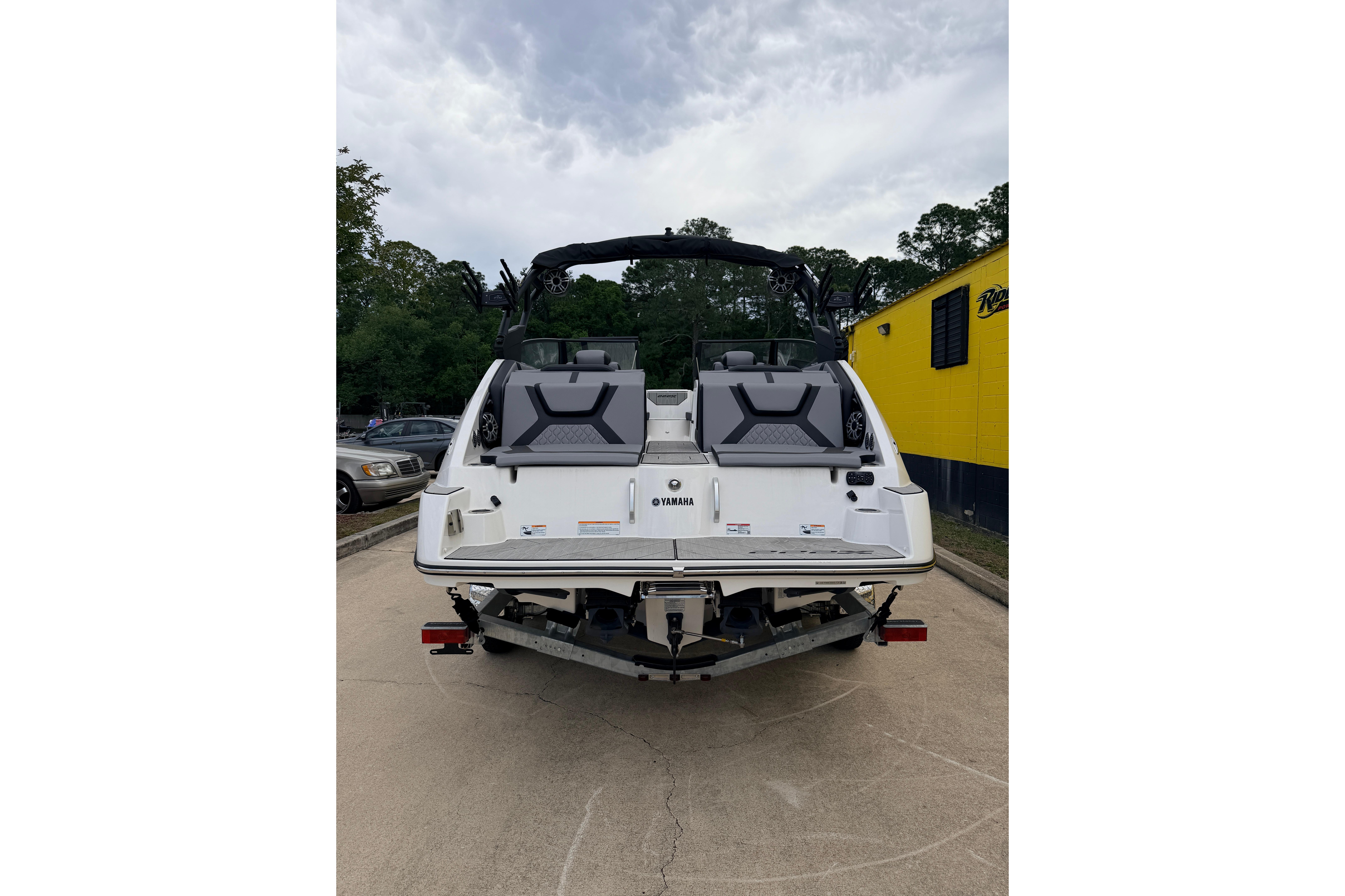 Rear view of a 2026 Yamaha Boats 222XD on a trailer.