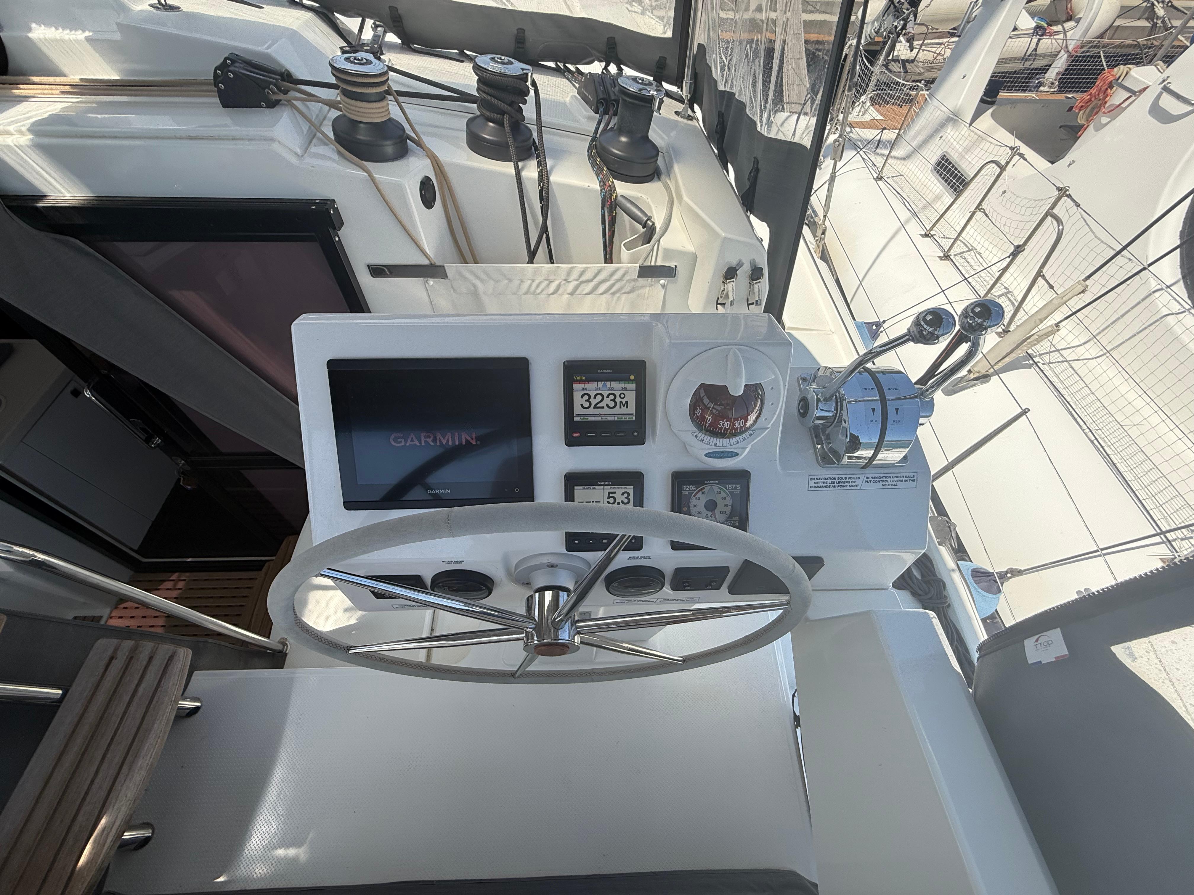 Cockpit of 2022 Fountaine Pajot Astrea 42 catamaran with Garmin navigation system.