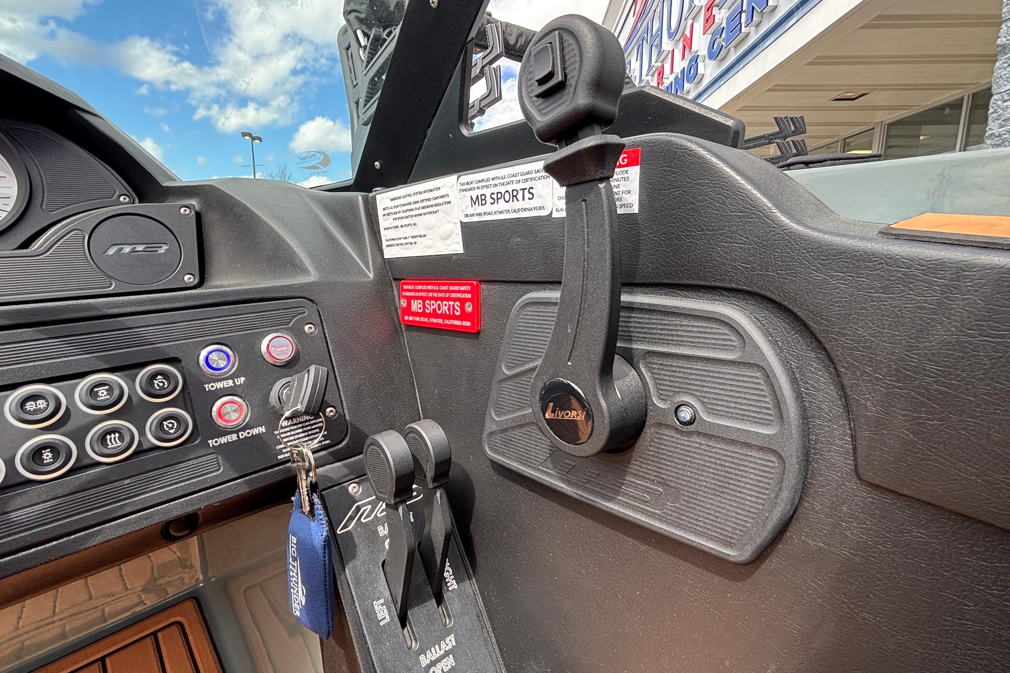 Control panel of 2026 MB B52 23 Classic boat with throttle and switches.
