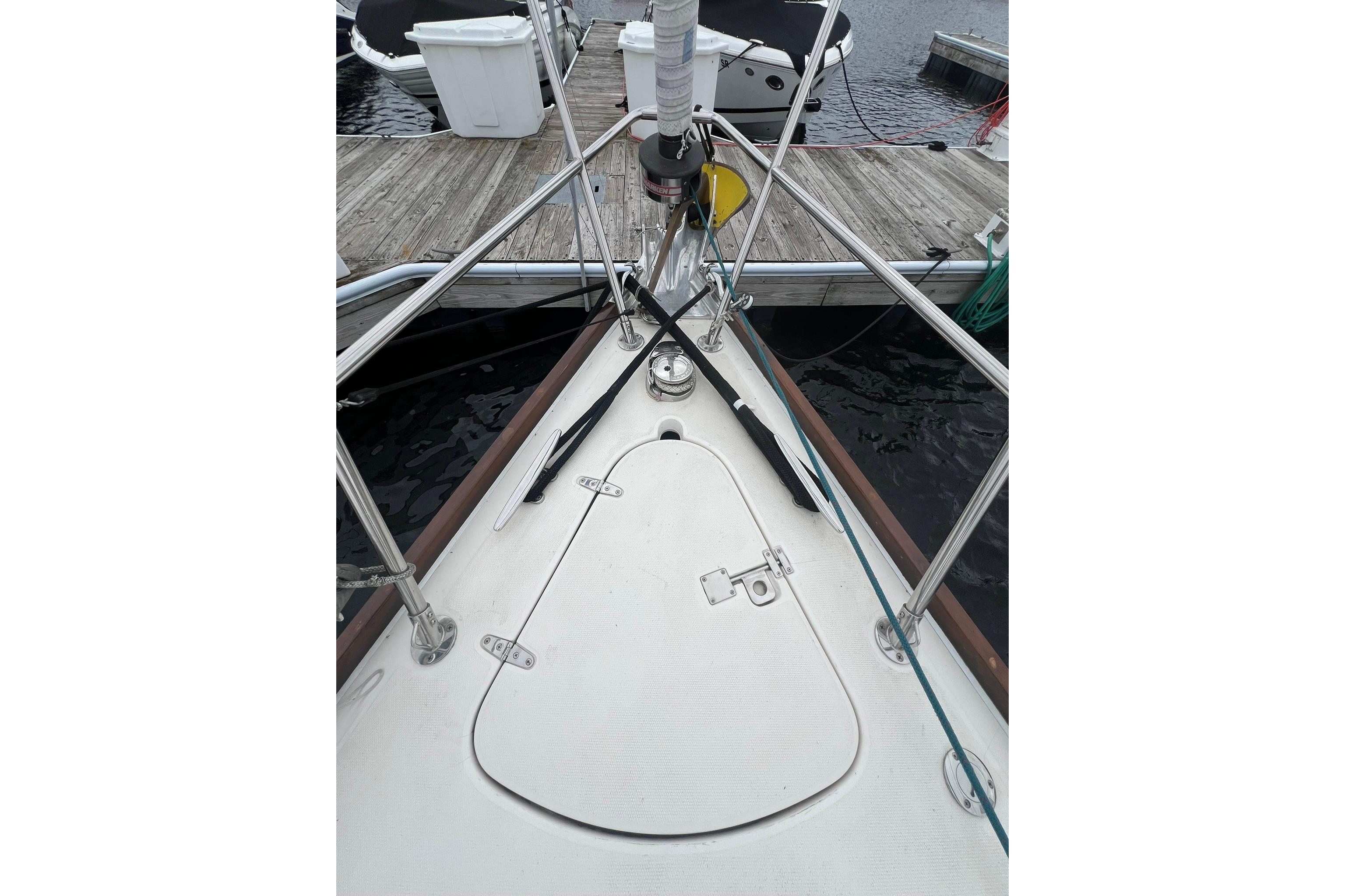 Bow of a 1998 Sabre 362 sailboat docked at a marina.