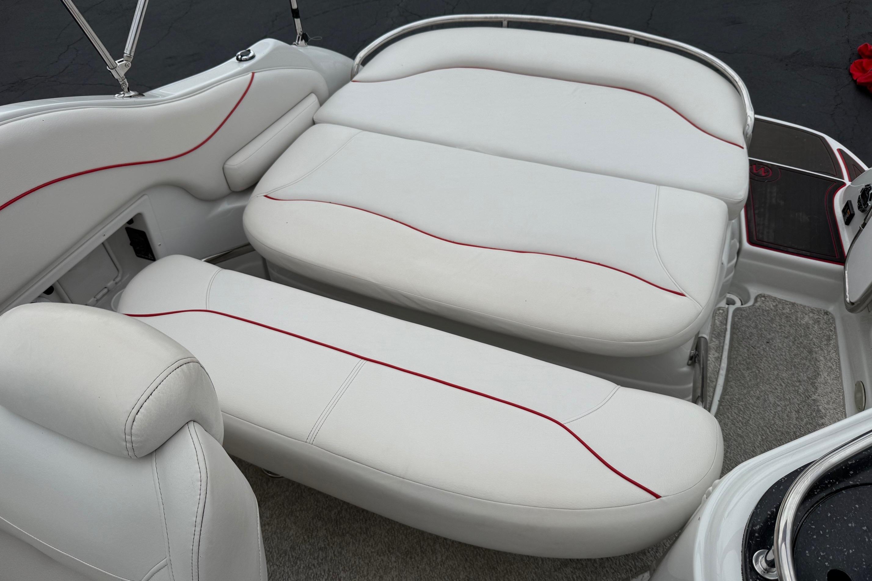 2005 Crownline 250 CR boat interior with white seating and red accents.