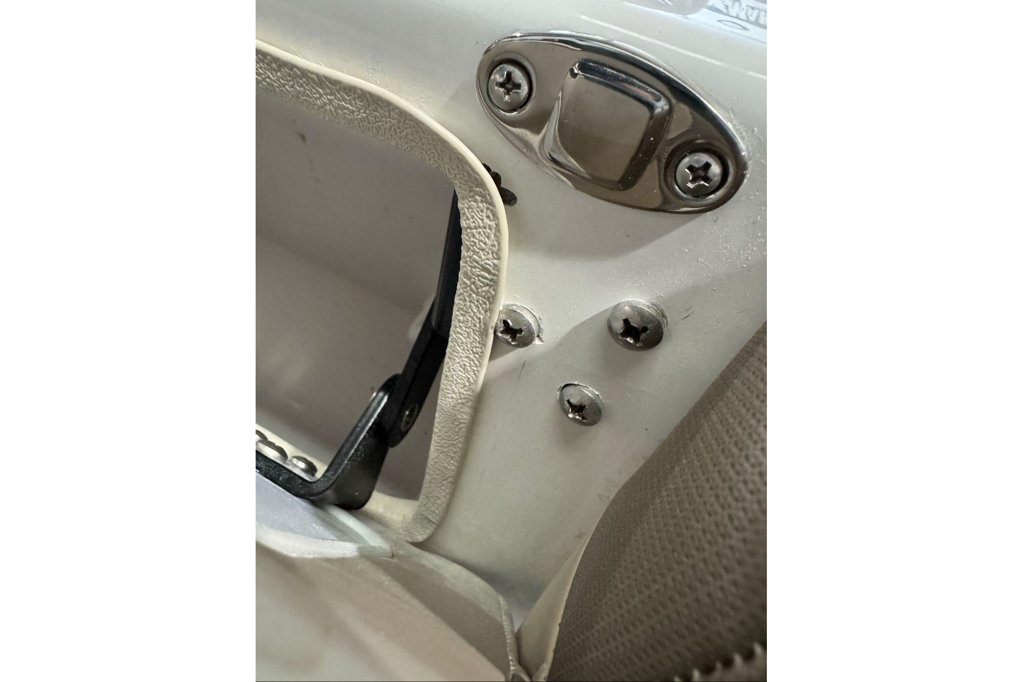 Close-up of 2026 Tahoe 2150 CC boat hardware and screws detail.