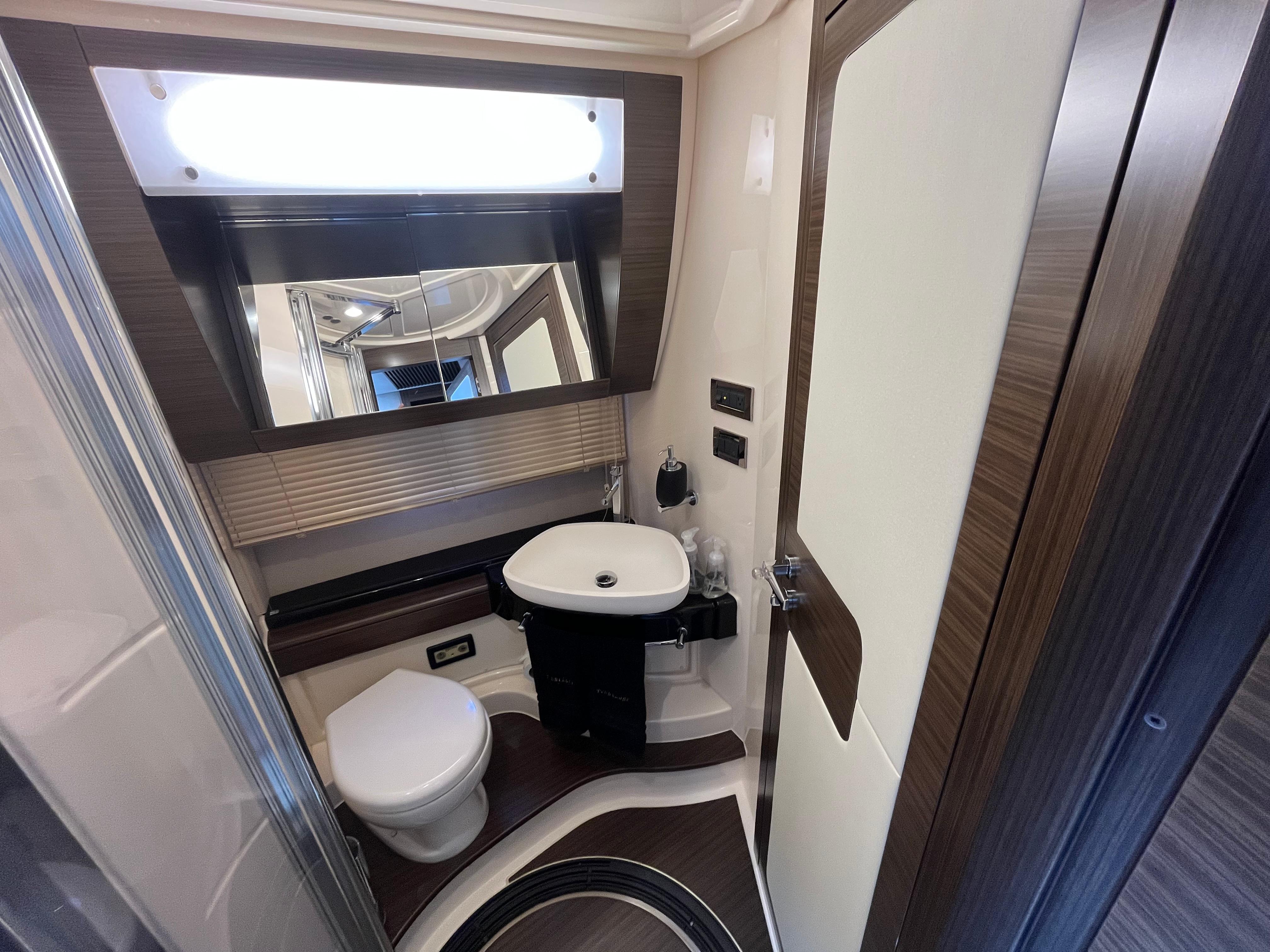 Luxurious bathroom interior of 2014 Azimut 55S yacht with modern fixtures and elegant design.
