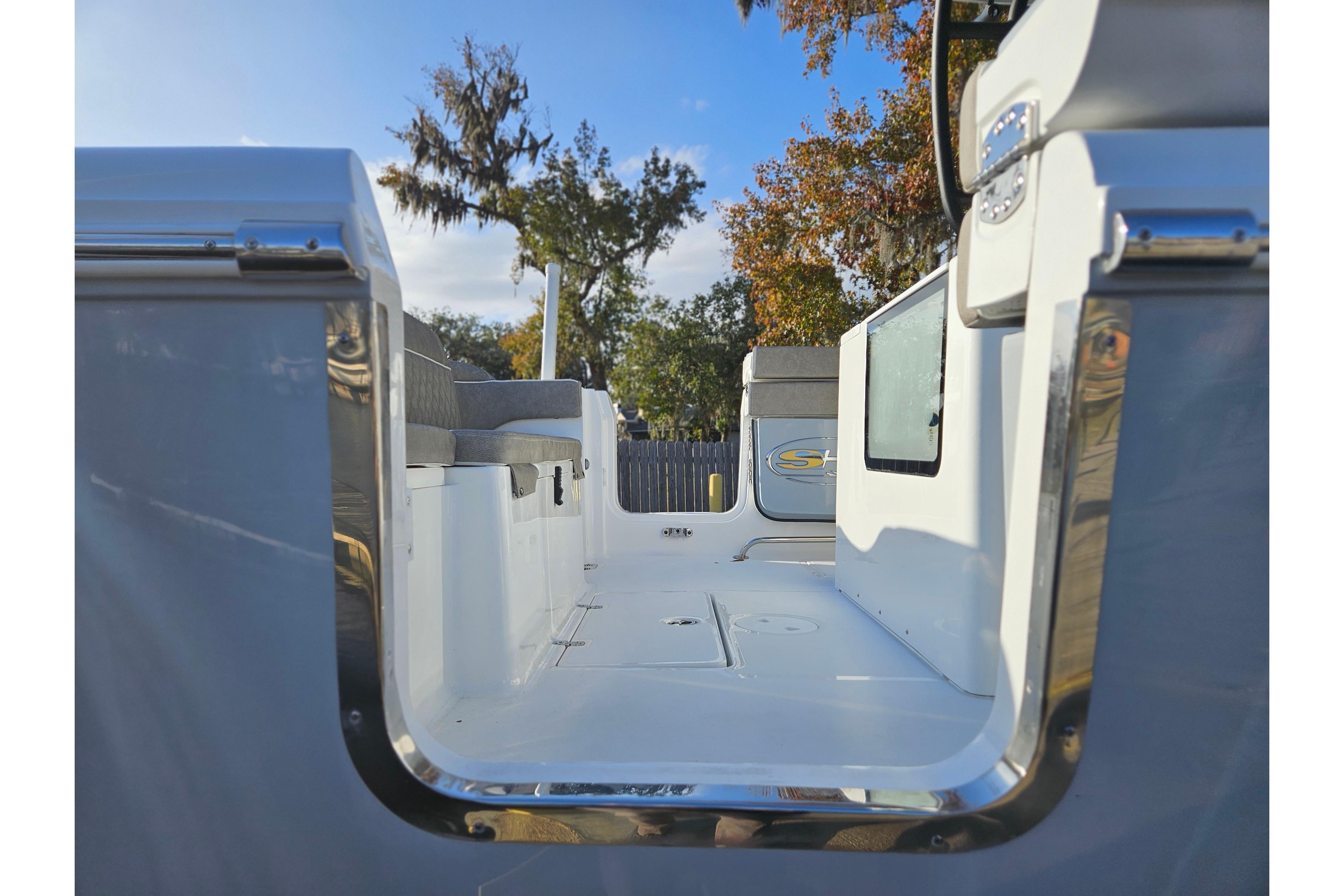 2026 Sea Hunt Ultra 285 SE boat interior with seating and open deck.