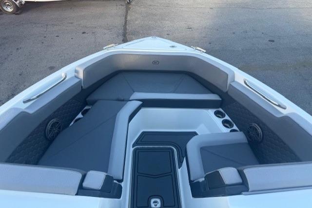 2023 Cobalt R6 Surf boat interior with gray seating and cup holders.
