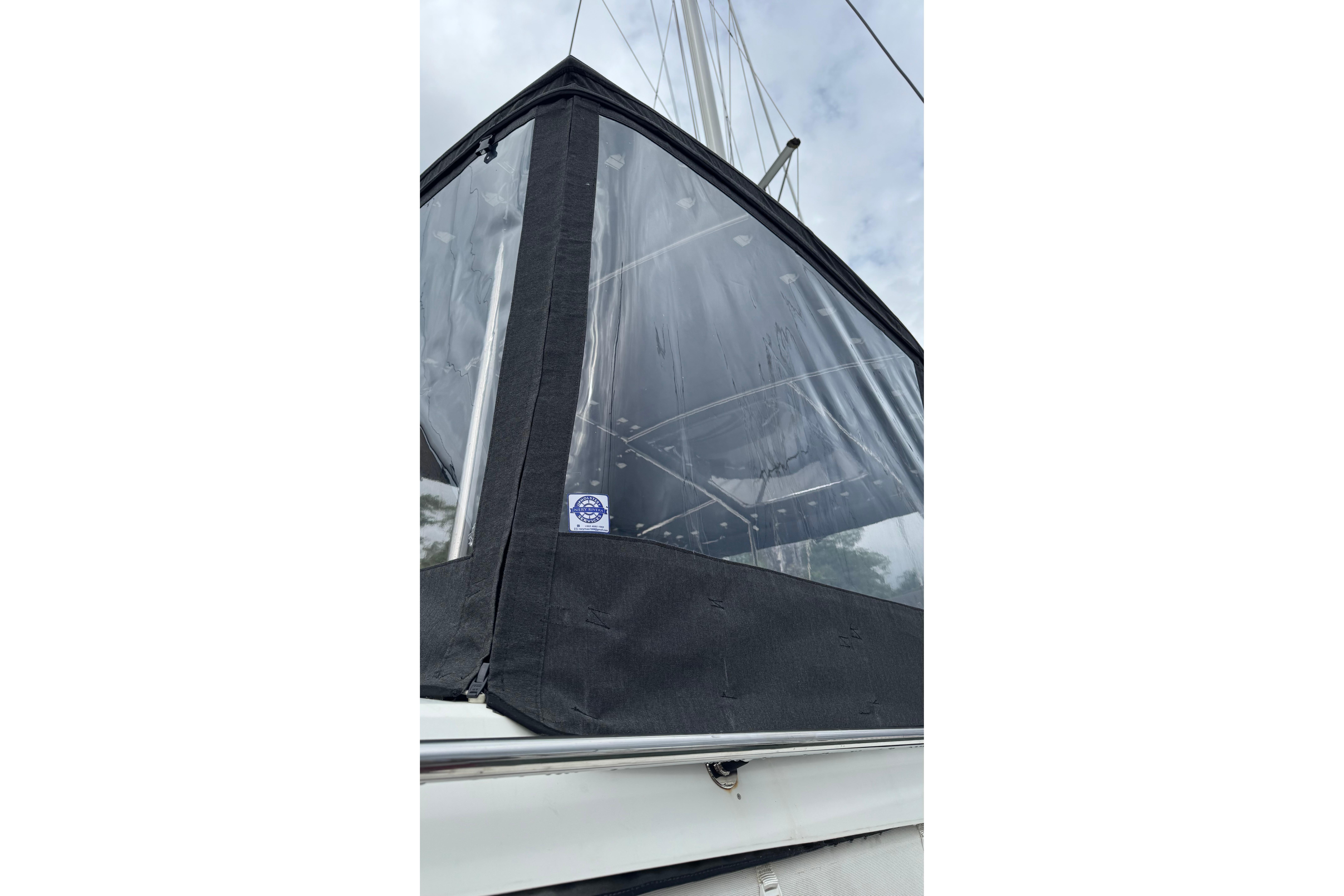 2020 Fountaine Pajot Saona 47 sailboat with protective enclosure, showcasing sleek design.