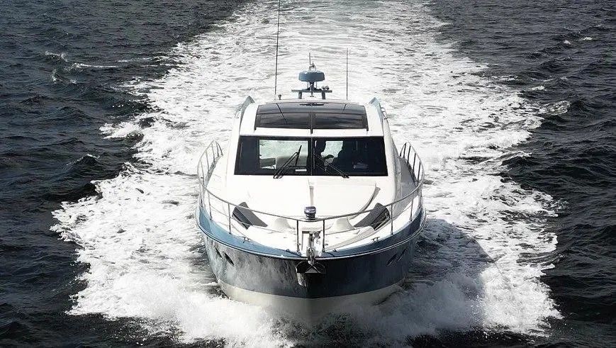 A 2010 Marquis Sport Coupe speeding across the water.