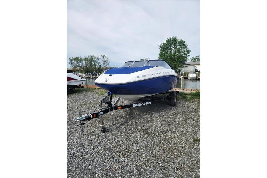 2012 Sea-Doo Sport Boats 180 Challenger on trailer, parked outdoors near water.