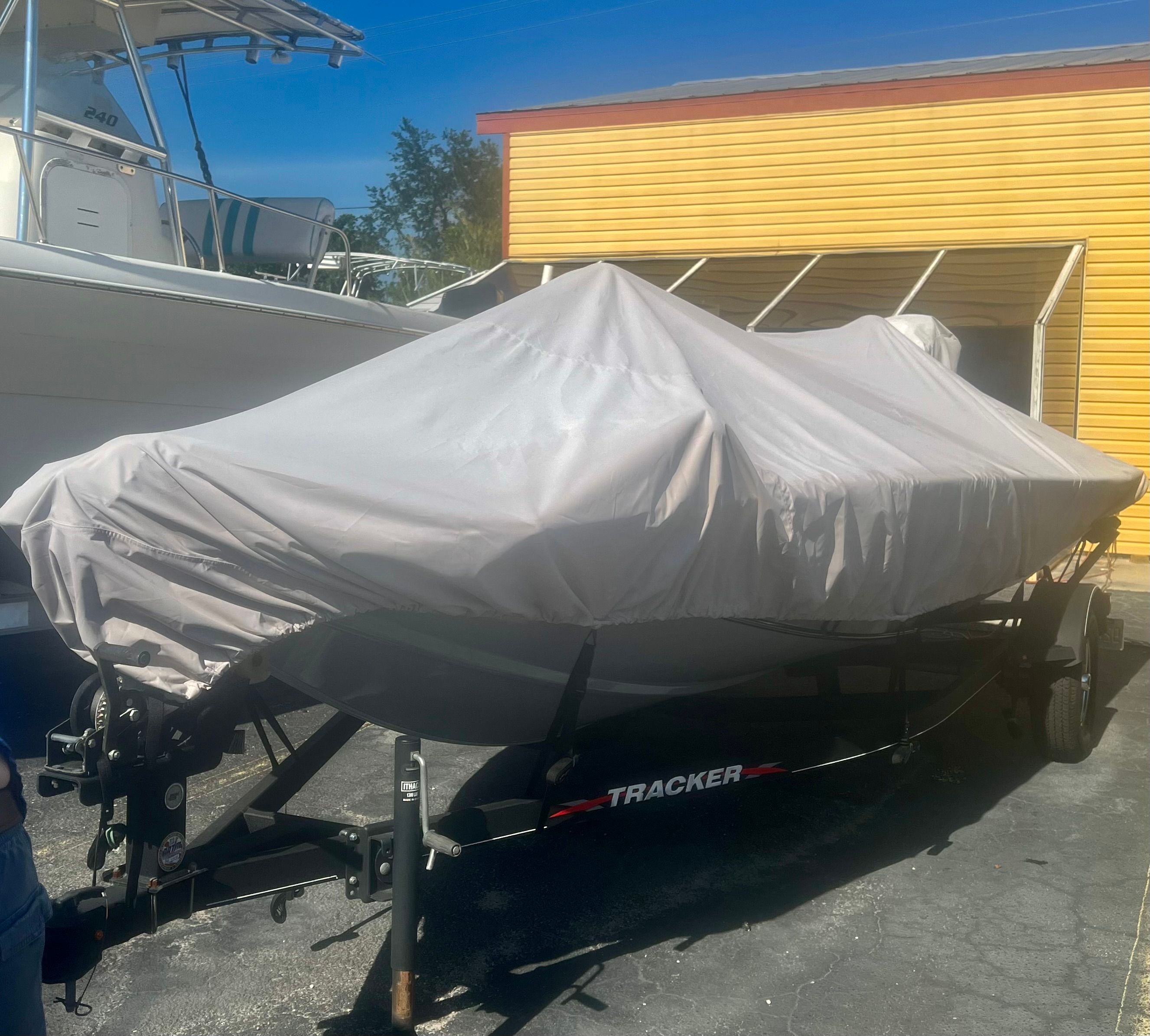 Covered Tracker PRO boat on trailer, 2023 model.