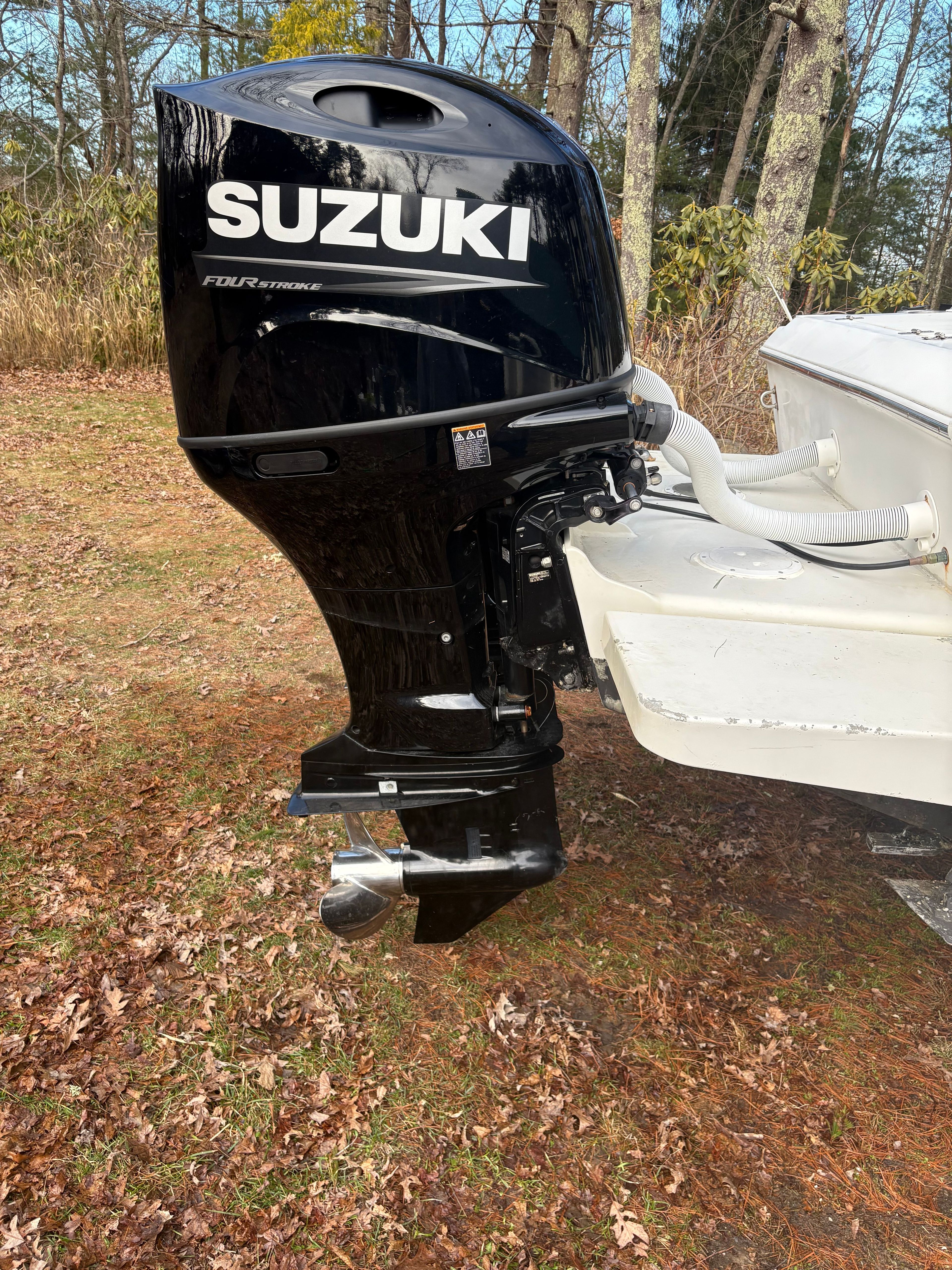 Suzuki outboard motor on Spacecraft Cuddy 2000 boat.