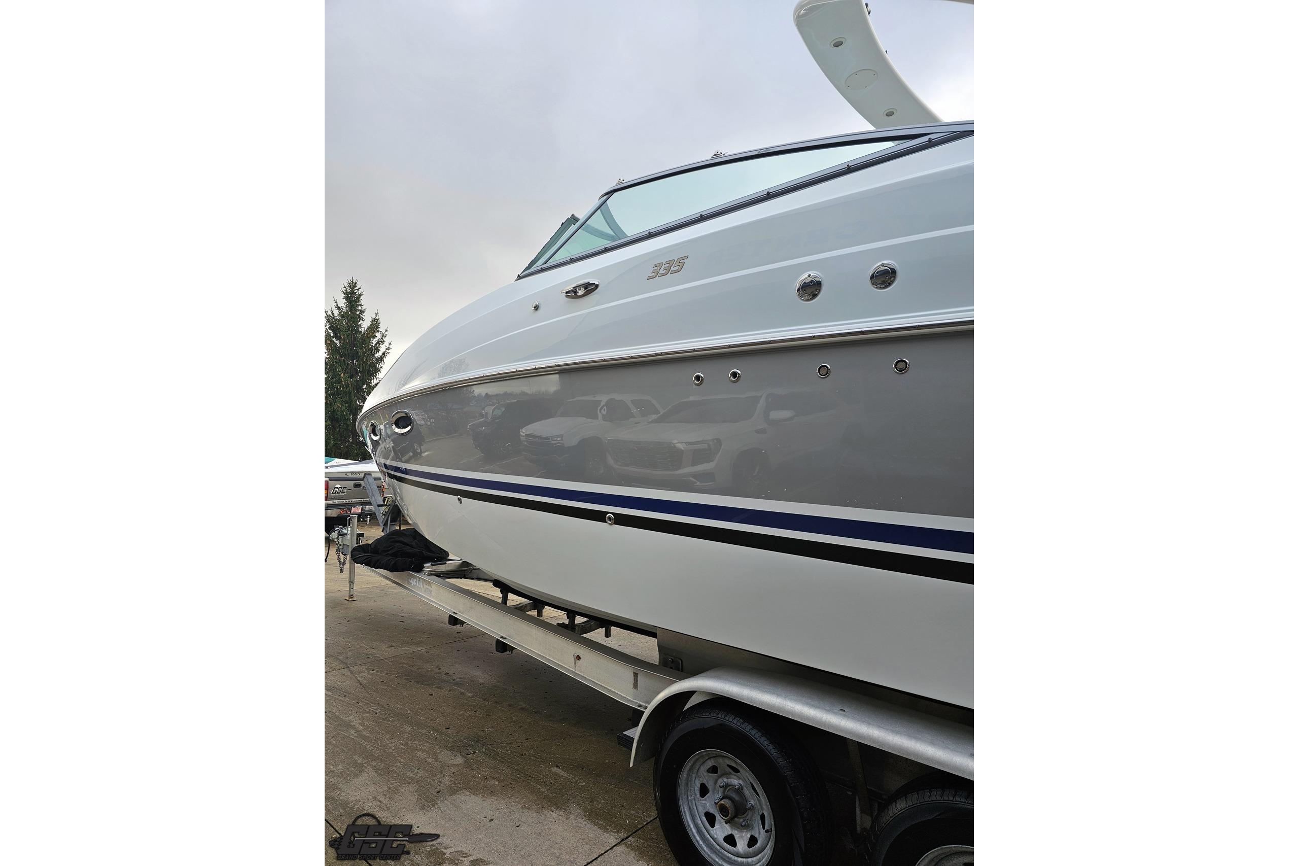 2008 Baja 335 Performance boat on trailer, showcasing sleek design and modern features.