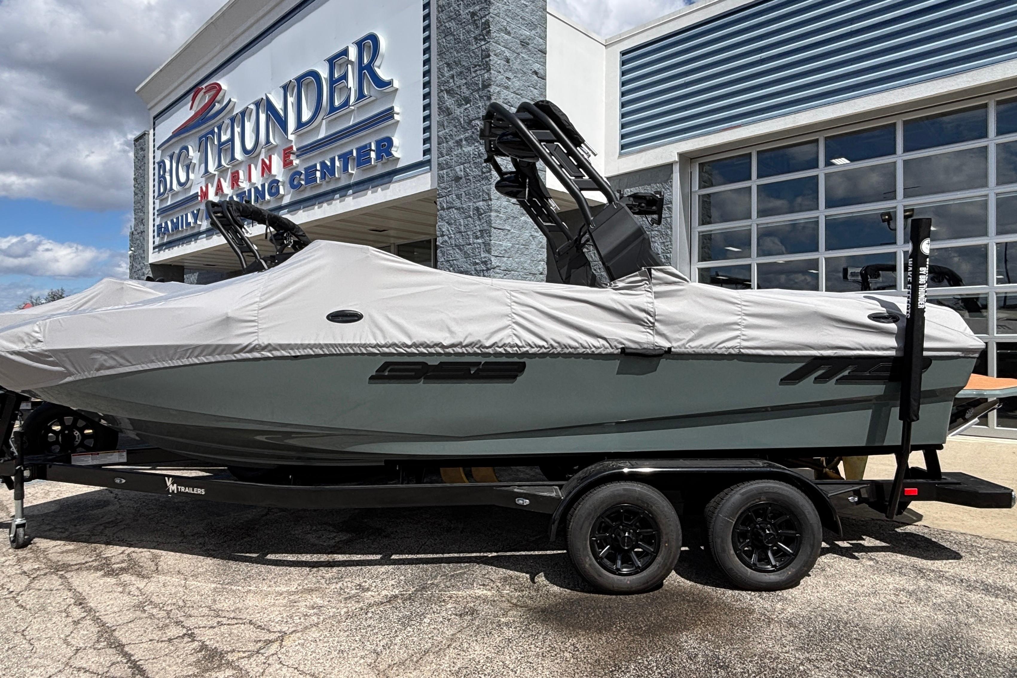 2026 MB B52 23 Classic boat covered, parked at Big Thunder Marine center.