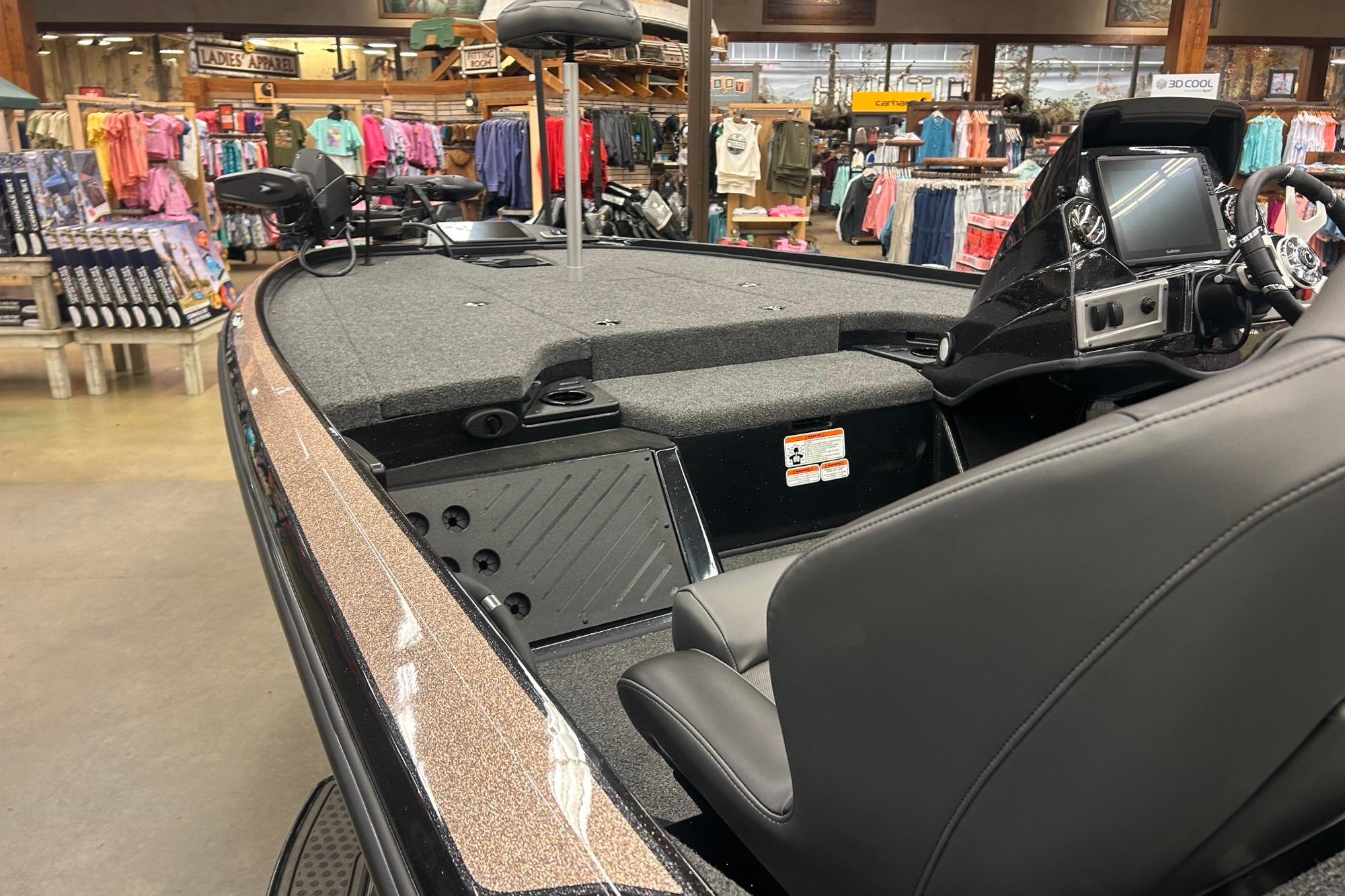 2026 Nitro Z18 Pro boat interior in a showroom, featuring seating and control panel.