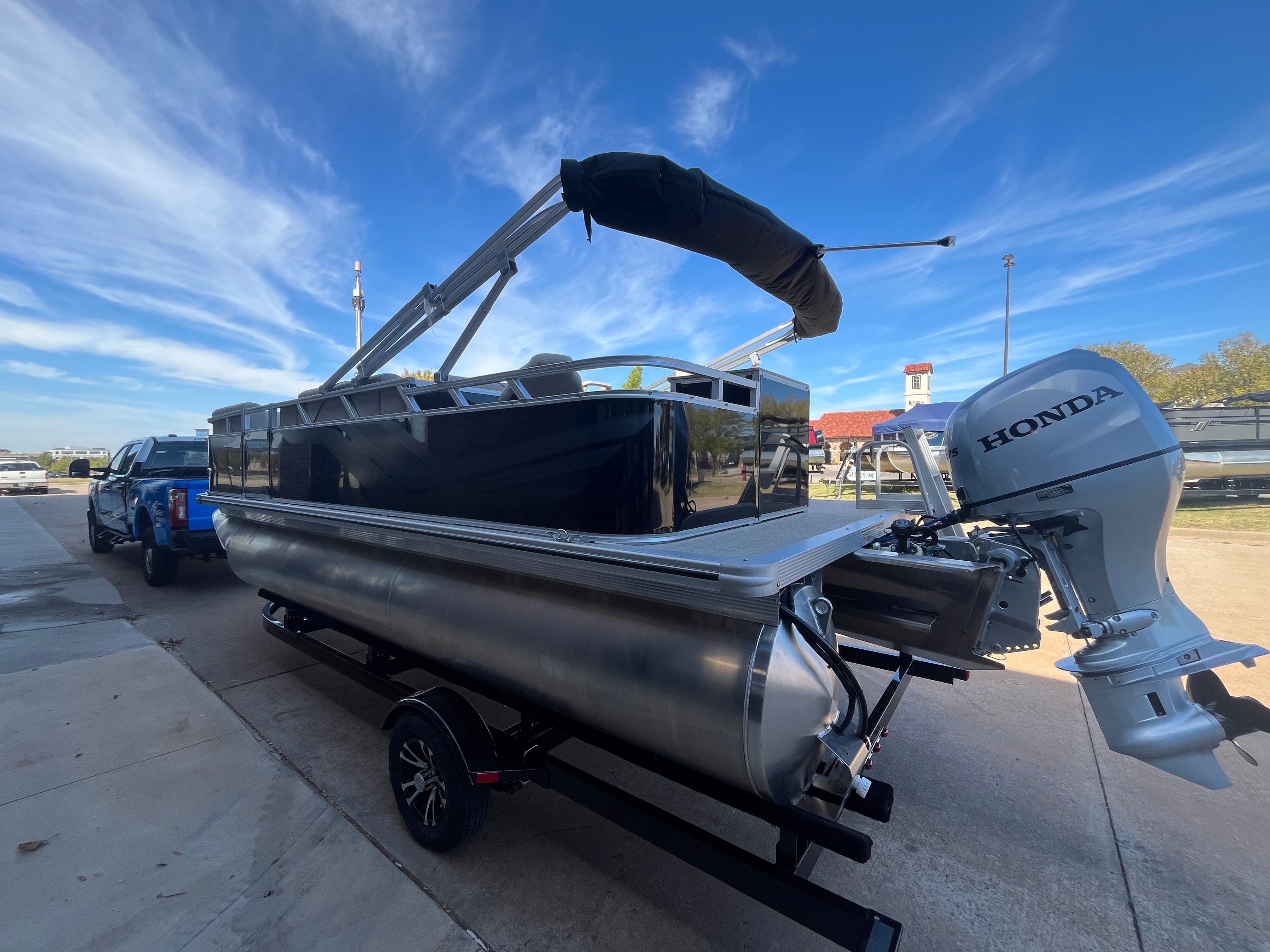 Tahoe 1925 Sport Rear Fish 2026 with Honda engine on trailer.