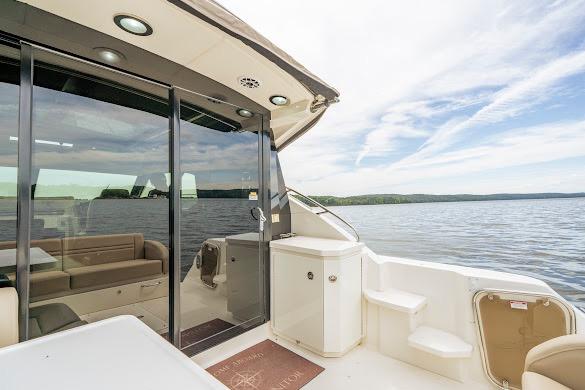 2016 Sea Ray Sundancer 510 yacht with spacious deck and serene water view.