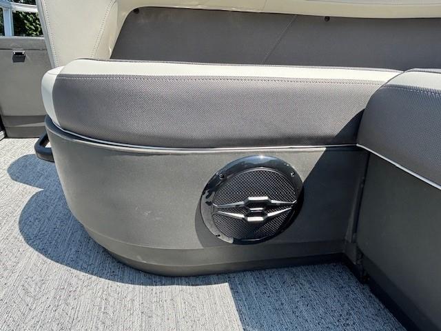 2026 Sun Tracker Bass Buggy 18 DLX boat interior with speaker and cushioned seating.