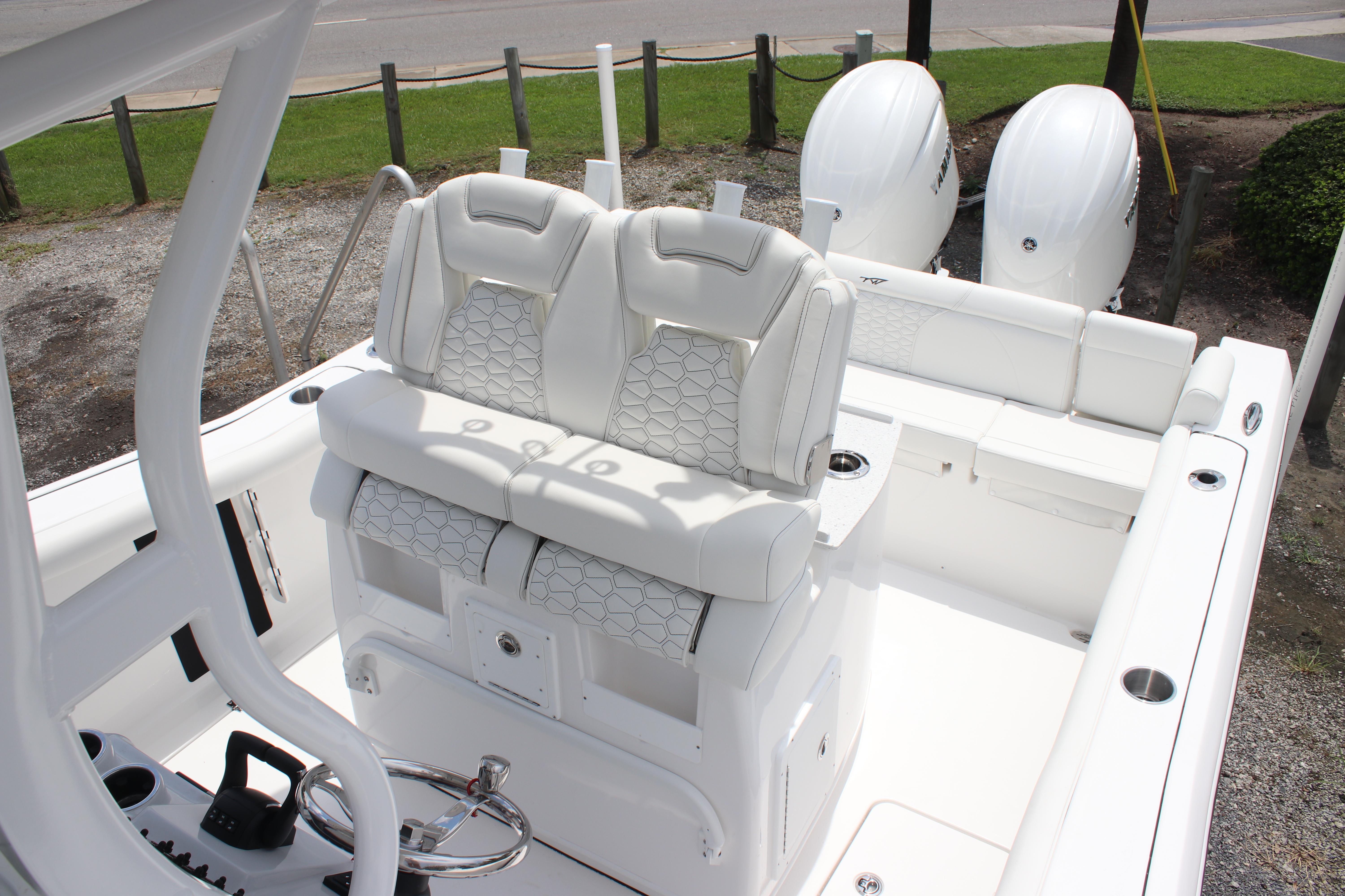 2026 Tidewater 272 LXF boat interior with dual seats and twin engines.