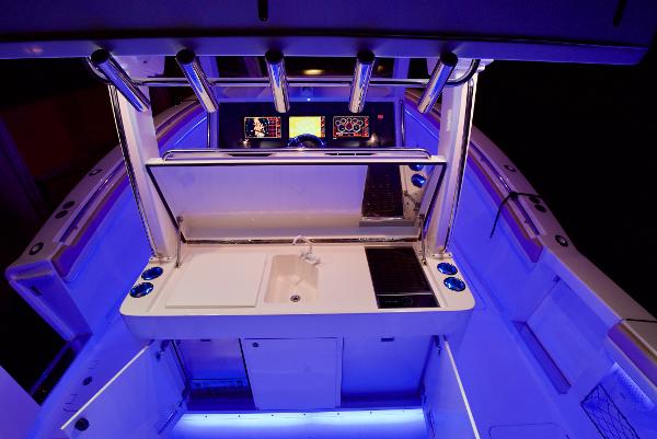 2019 Altima 38 Xcape boat interior with illuminated control panel and modern amenities.