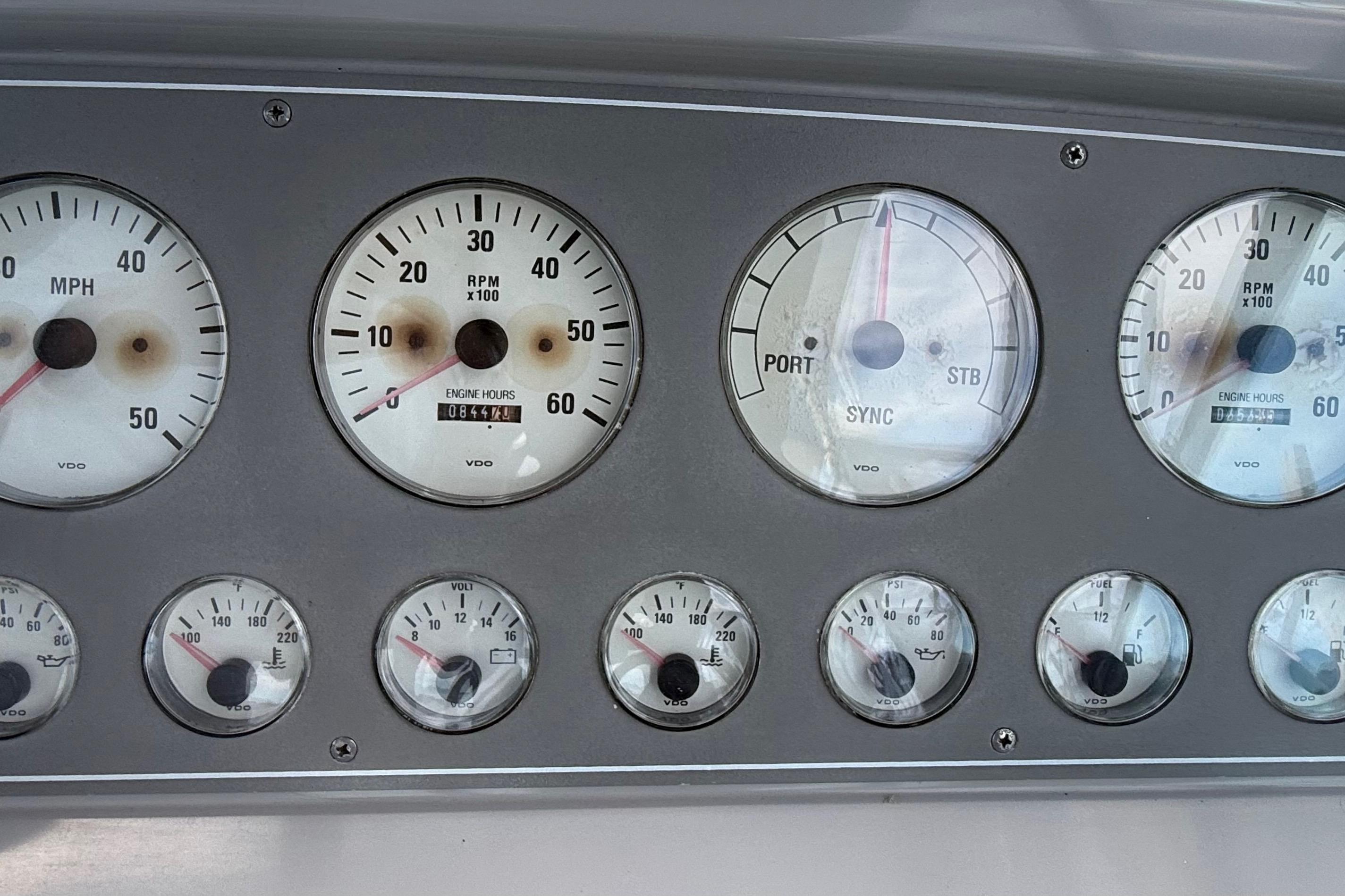 Dashboard of a 1999 Formula 34 Performance Cruiser with various gauges and dials.
