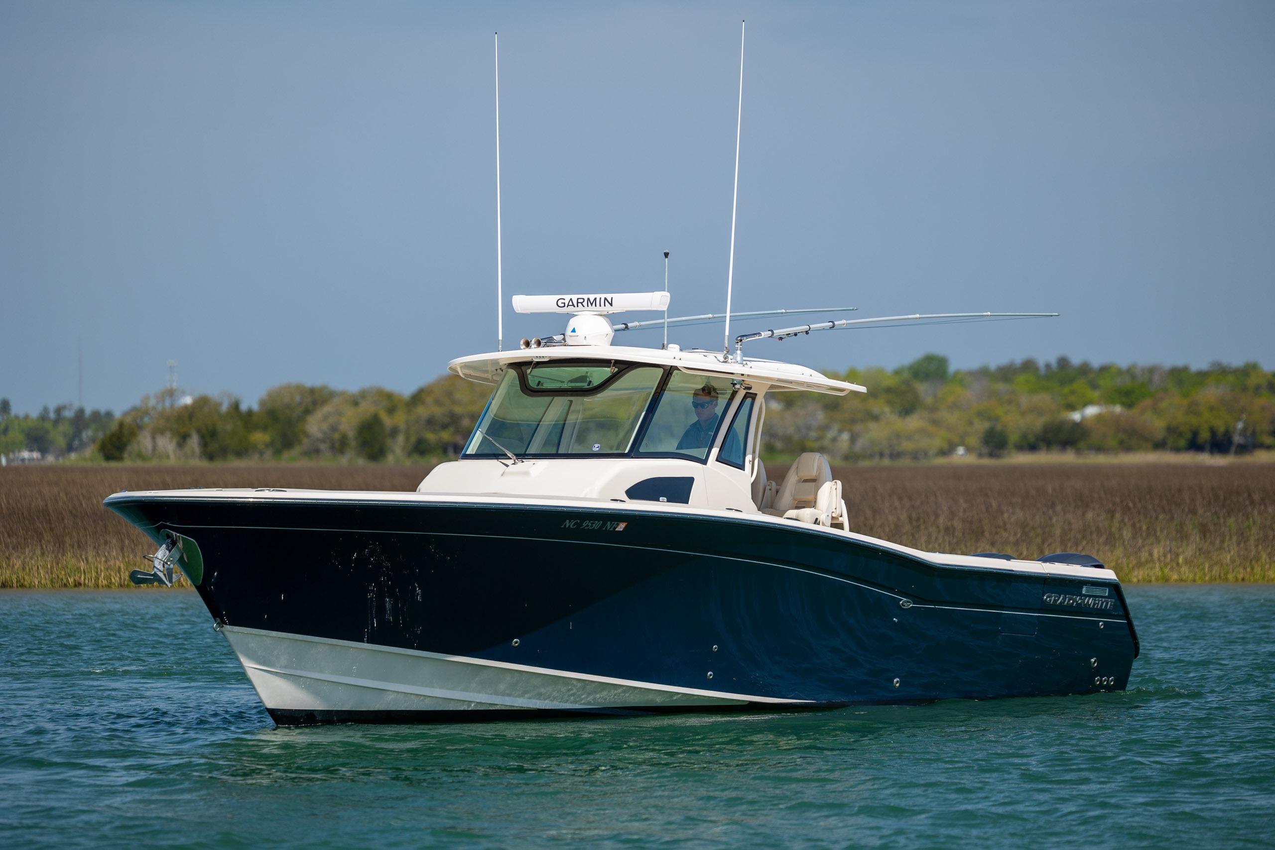 2017 Grady-White Canyon 376 boat on calm water with Garmin equipment.