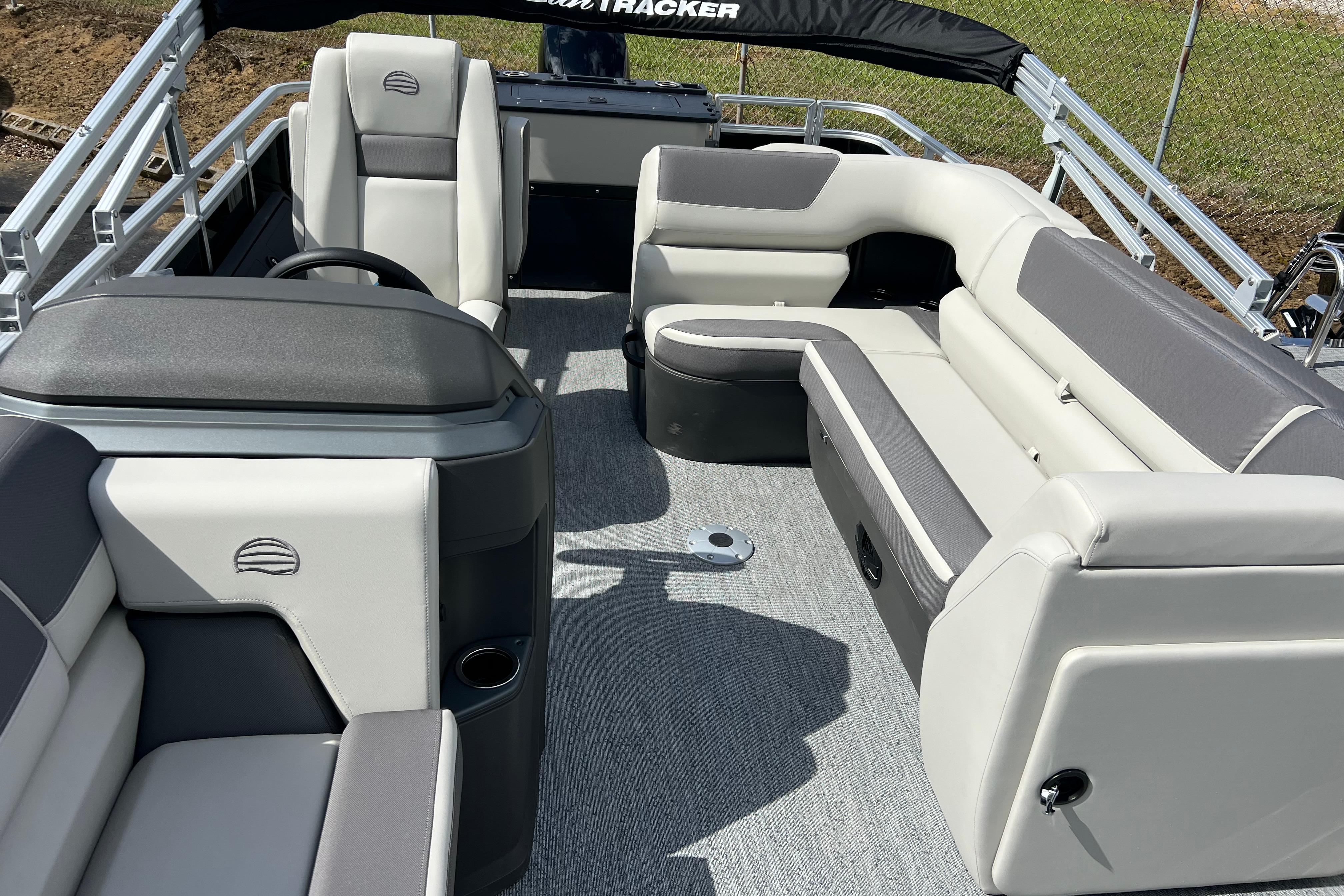 2026 Sun Tracker Fishin' Barge 22 DLX interior with plush seating and modern design.