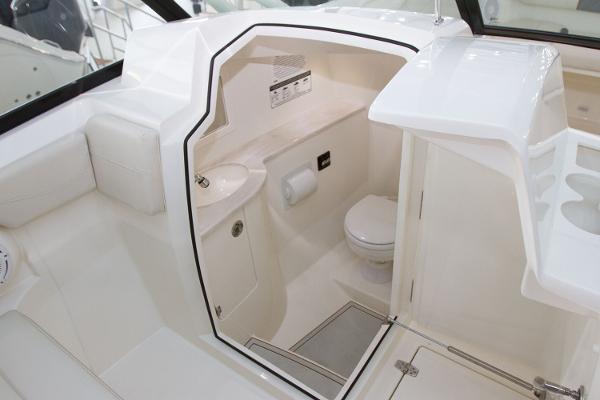 Manufacturer Provided Image: 2020 Cobia 280 Dual Console boat interior with toilet and sink.