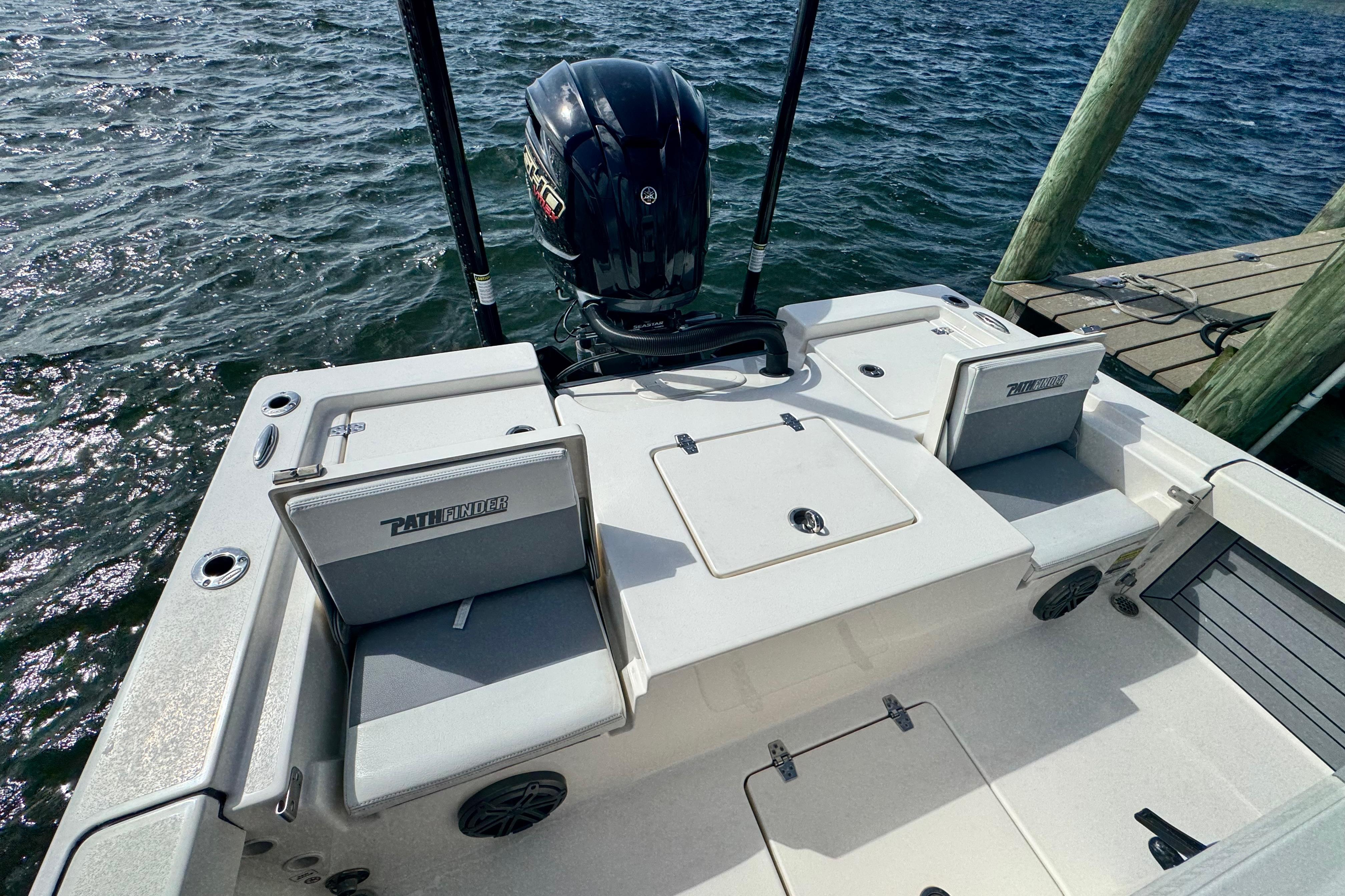 2022 Pathfinder 2400 TRS boat at dock, featuring spacious seating and powerful outboard motor.