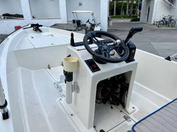 1986 Hoog Comet 14 boat interior with steering wheel and control panel.