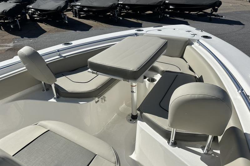 Interior of 2026 Key West 219 FS boat with seating and table setup.