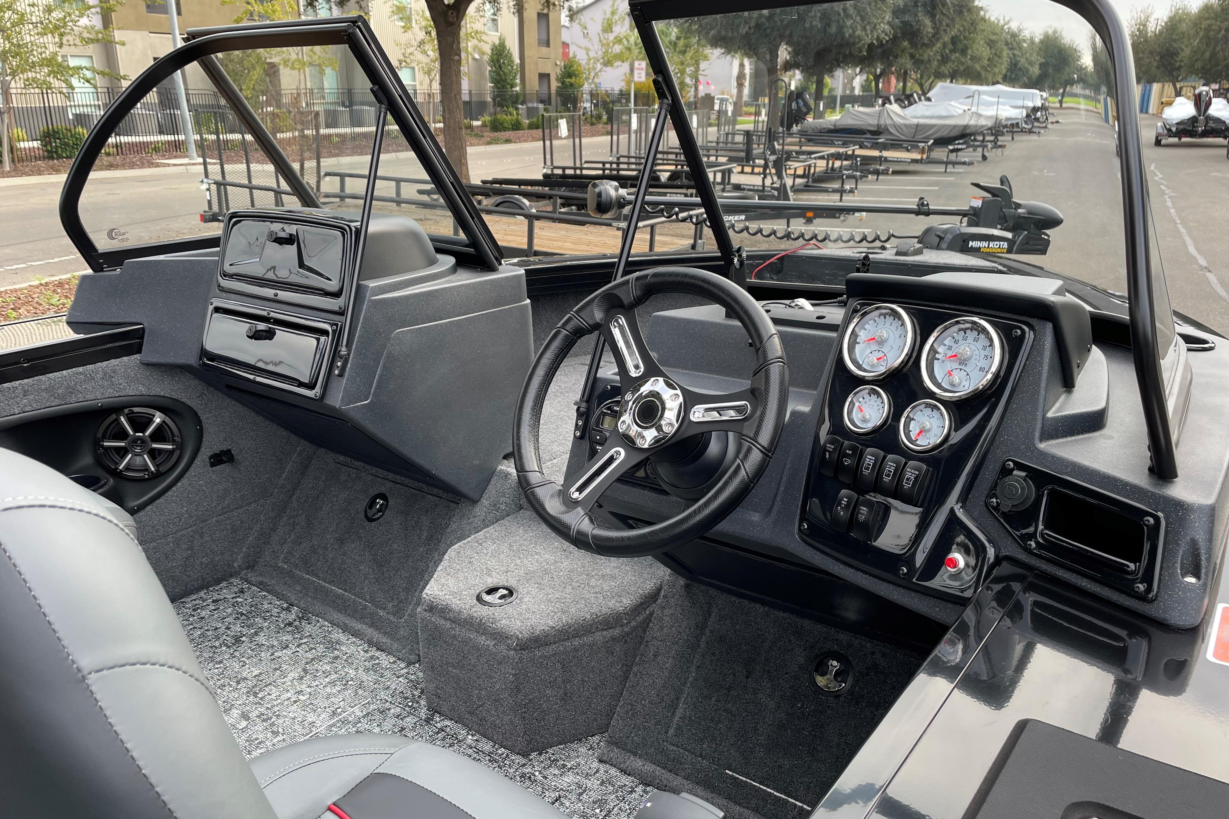 2026 Tracker Targa V-19 WT boat interior with steering wheel and dashboard controls.