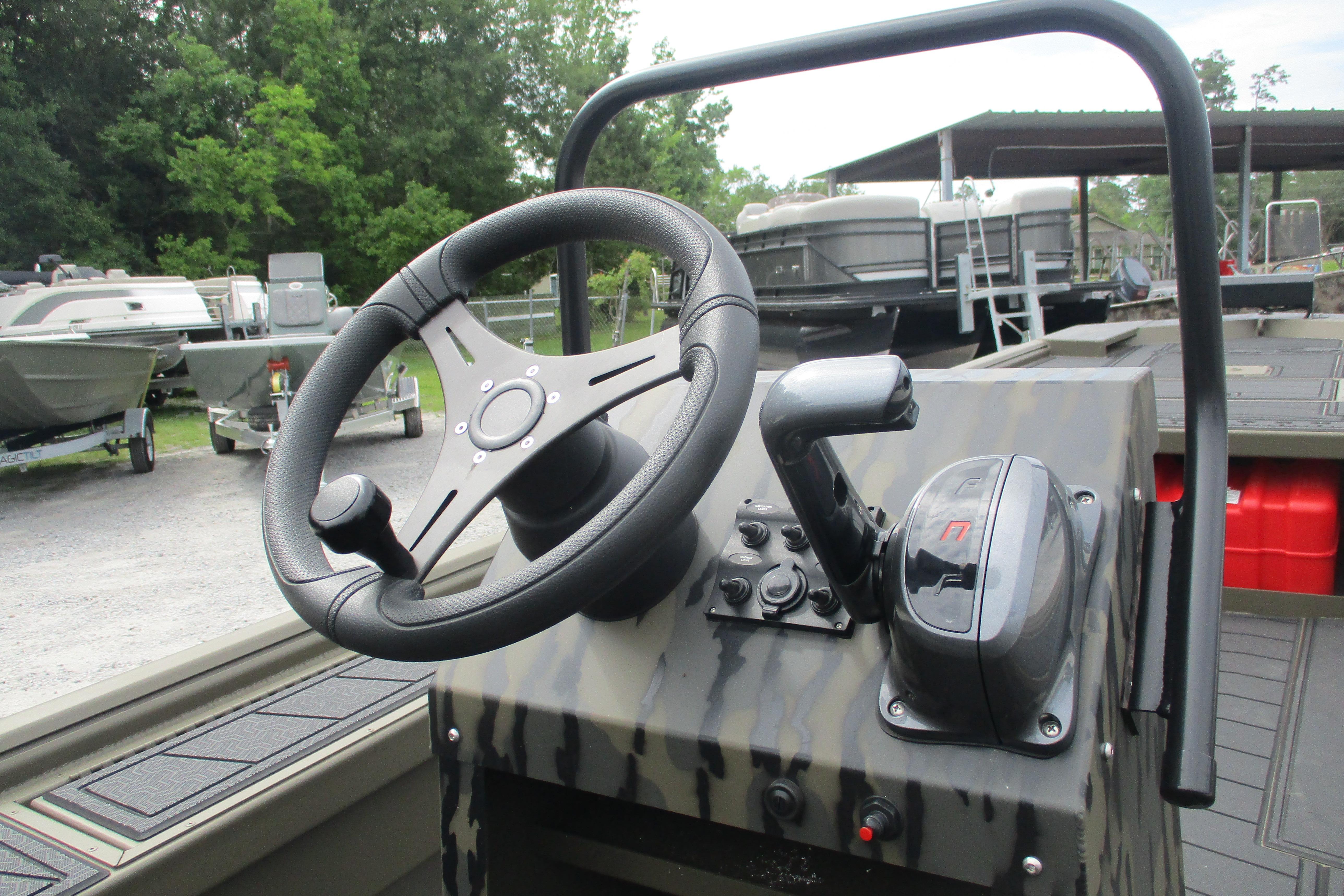 Steering console of 2026 Gator Tail 2060 Extreme CC boat, featuring modern controls.