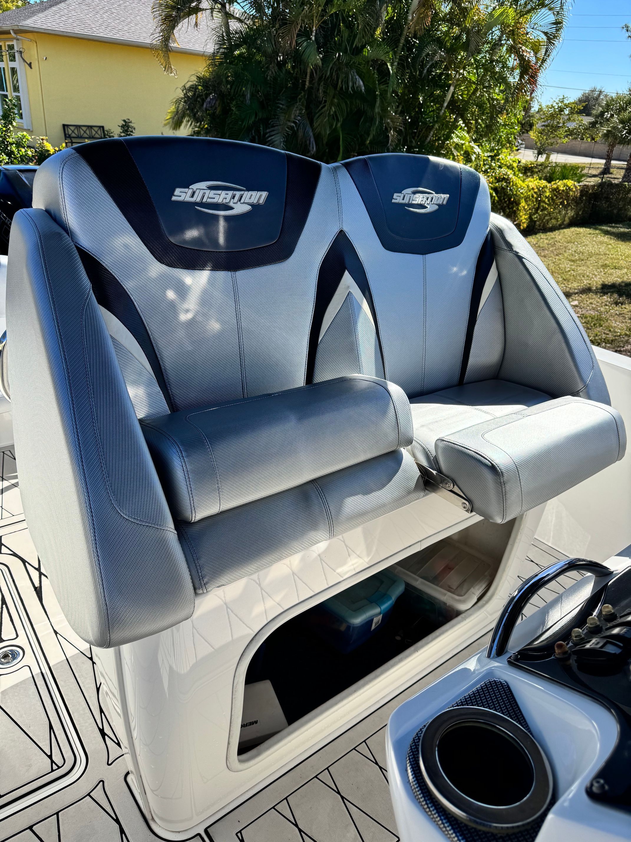Sunsation 32 CCX 2017 boat seats with storage compartment.