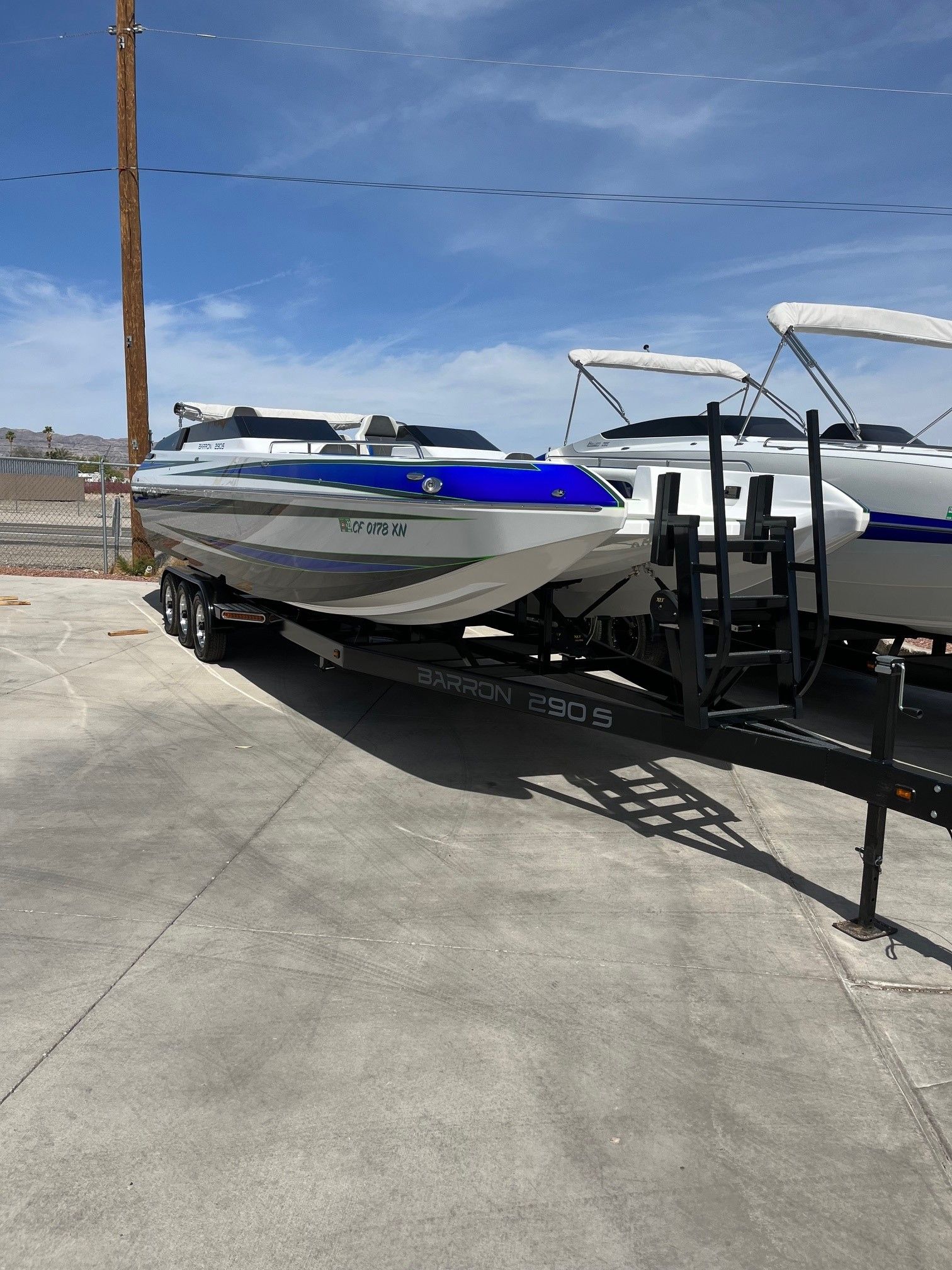 Custom Barron 290s boat from 2021 on a trailer.