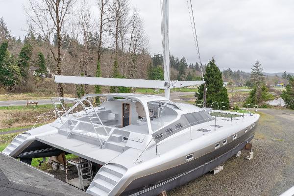 2025 Shuttleworth 52 AeroRig yacht on land, showcasing sleek design and modern features.