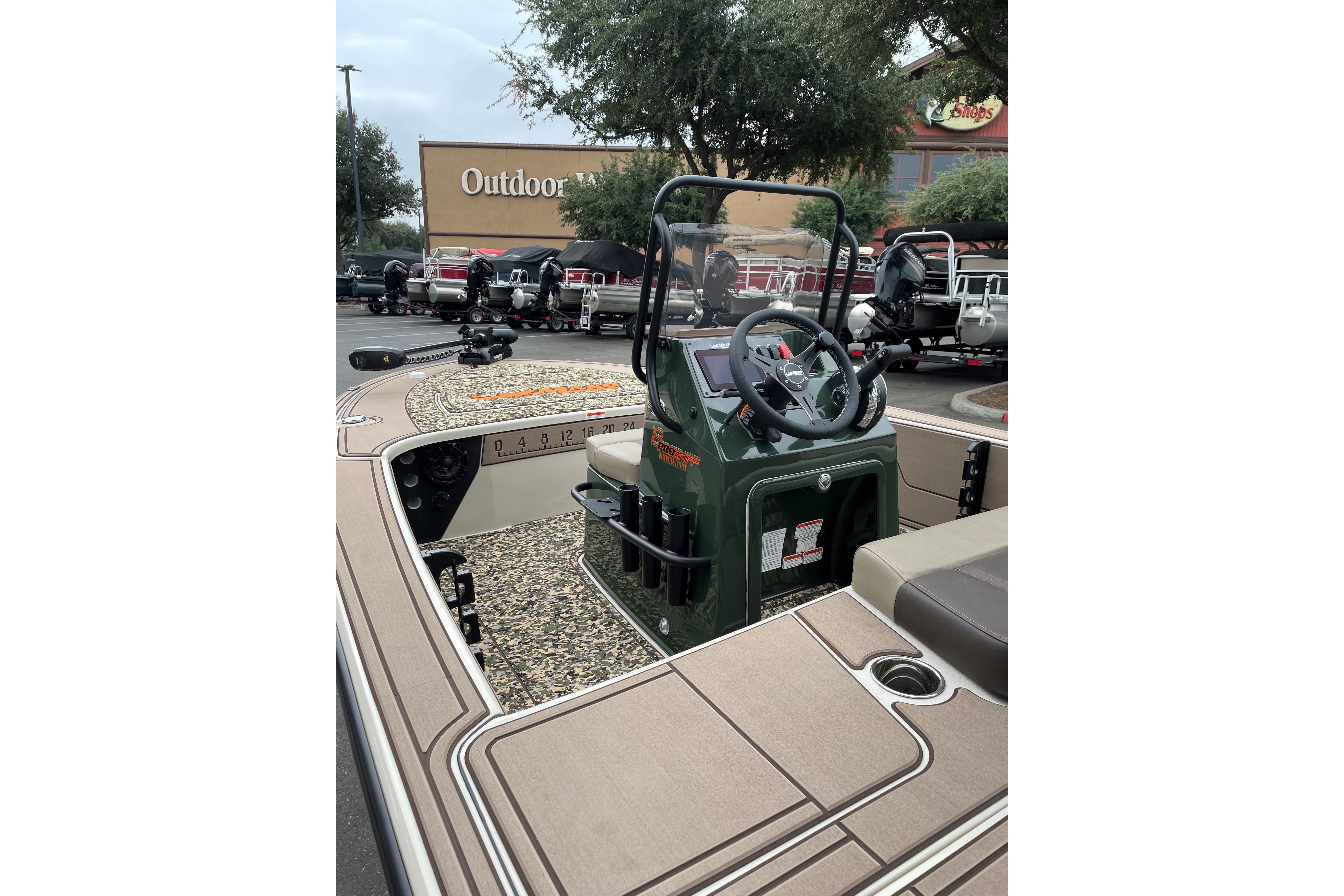 2025 Mako 18 Pro Skiff Backwater Edition boat at outdoor store display.