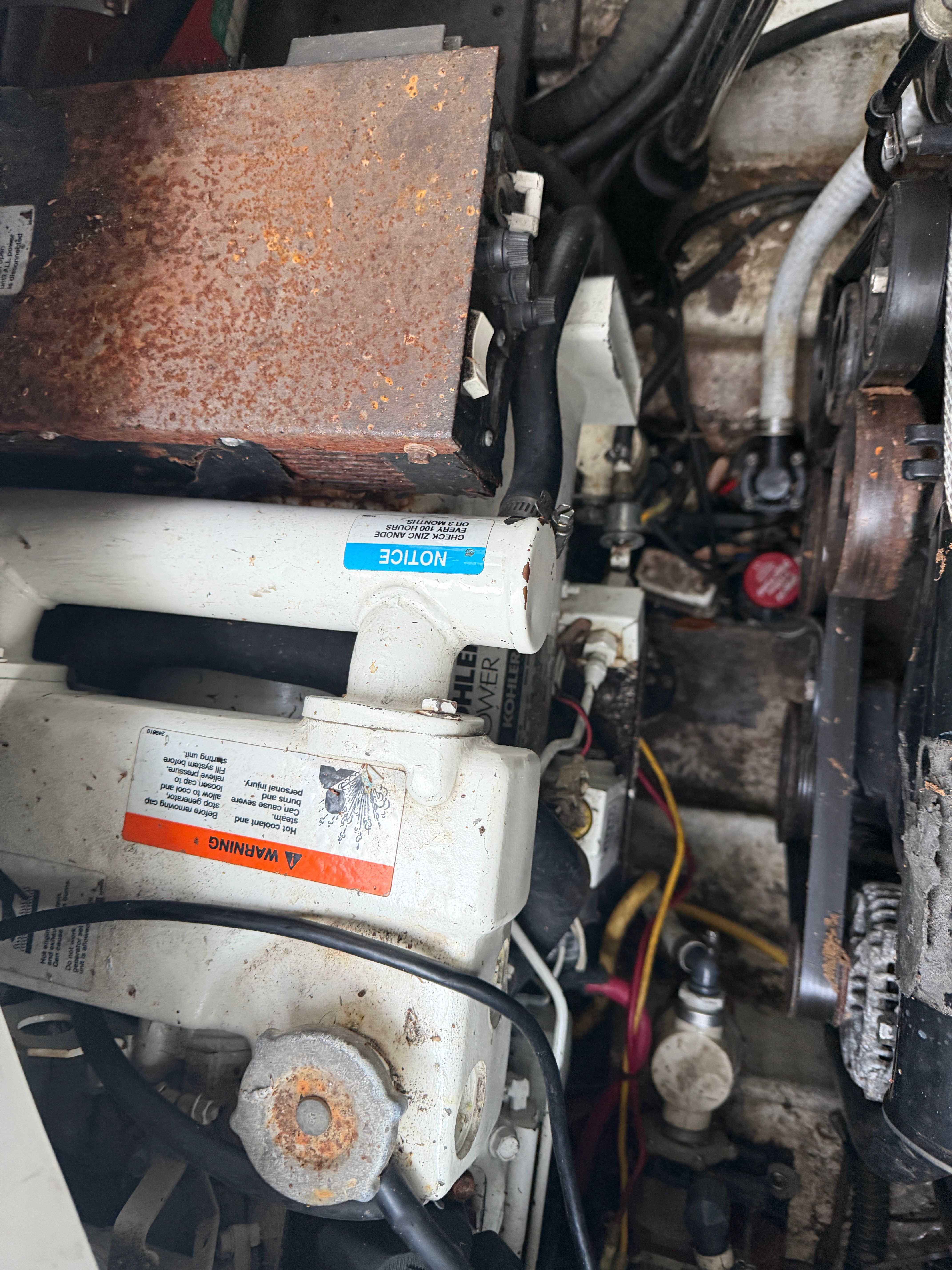 Engine compartment of a 2006 Crownline 270 CR boat with visible components.