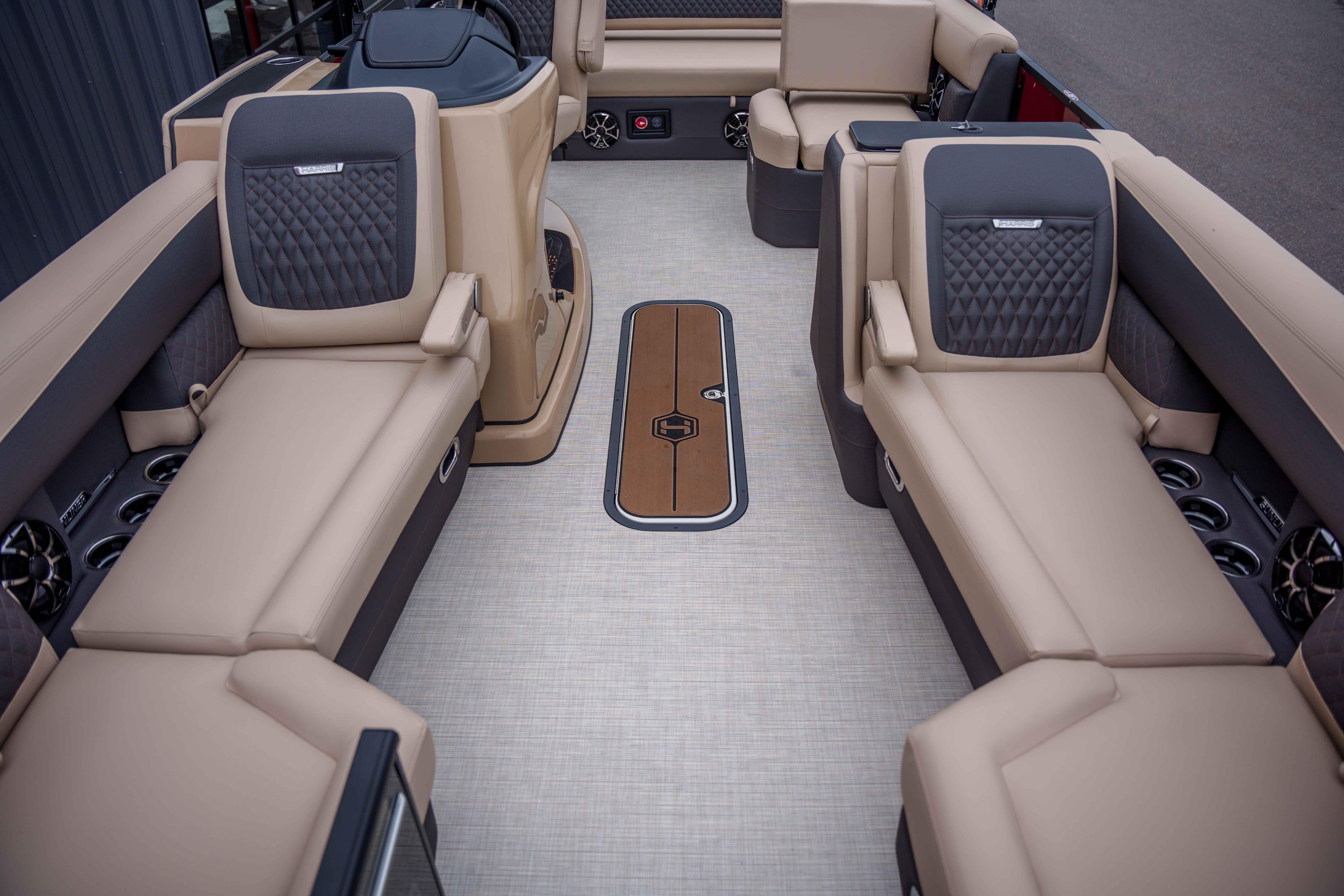 Luxurious interior of 2026 Harris Sunliner 230 pontoon boat with plush seating and modern design.