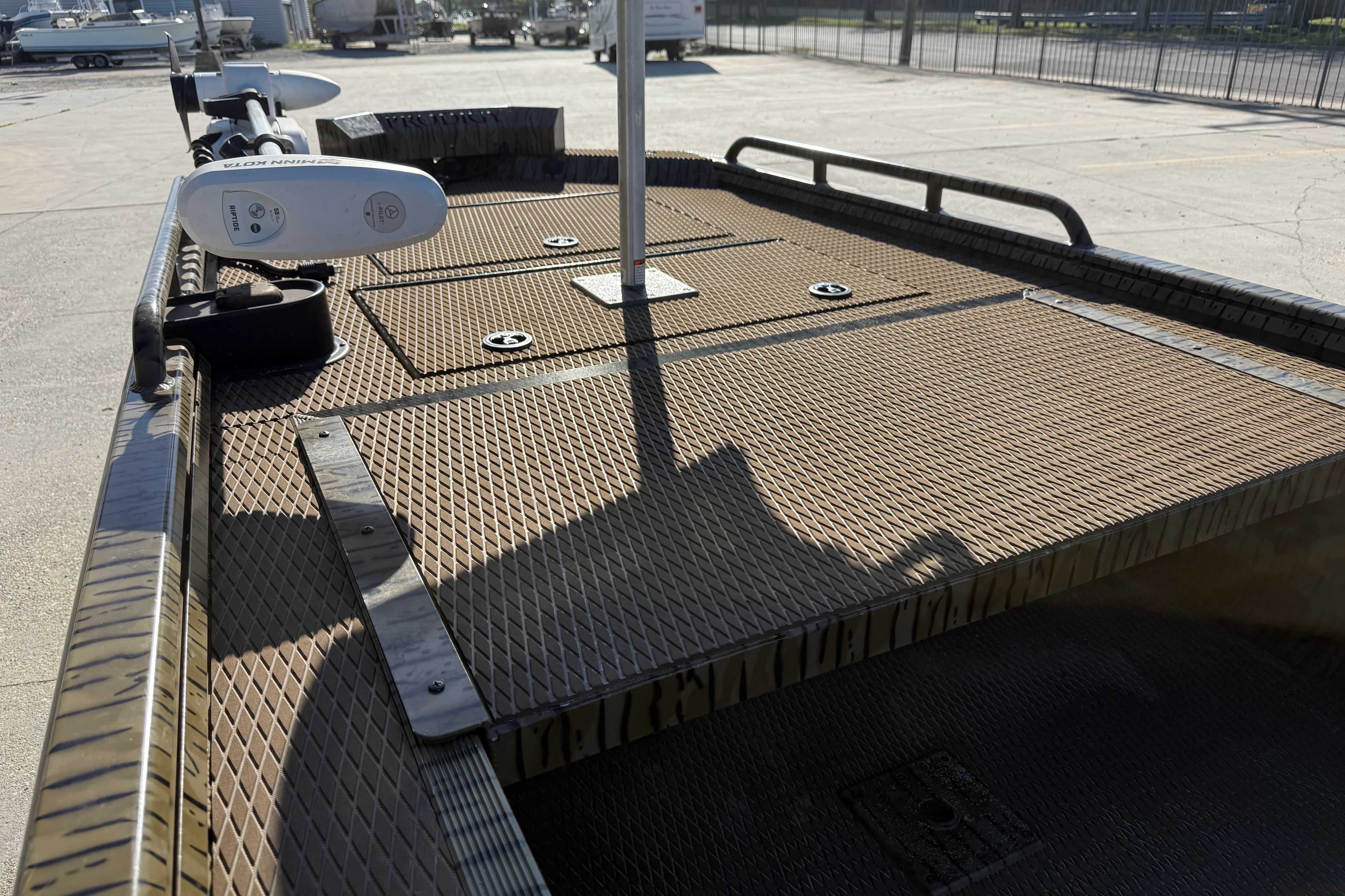 2022 Prodigy 1854 boat deck with textured surface and mounted equipment.