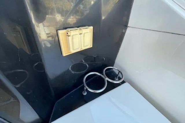 2016 Sea Ray Sundancer 510 interior detail with cup holders and wall fixture.