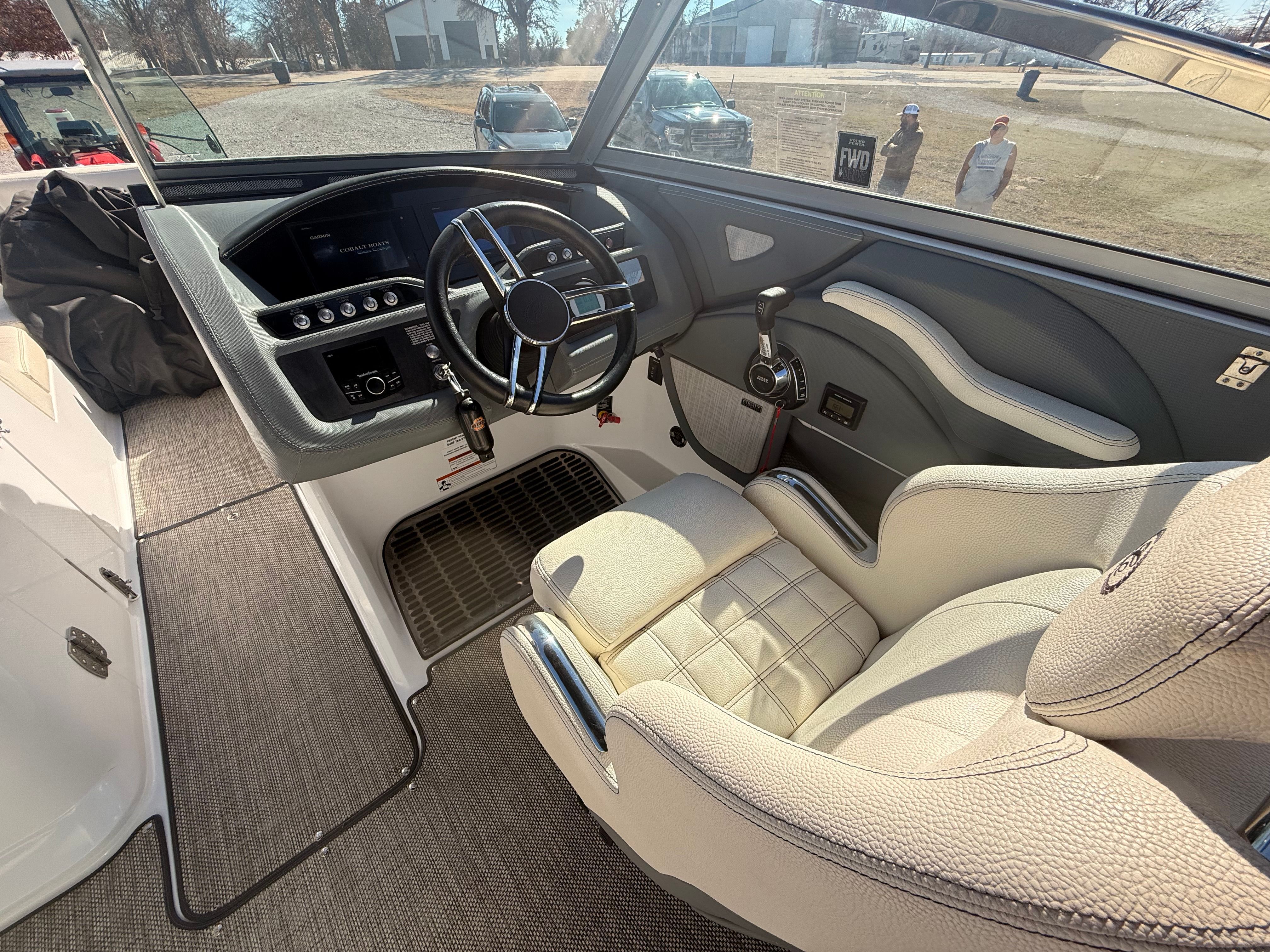 The image shows the cockpit of a 2019 Cobalt R7 Surf boat with a sleek steering wheel.