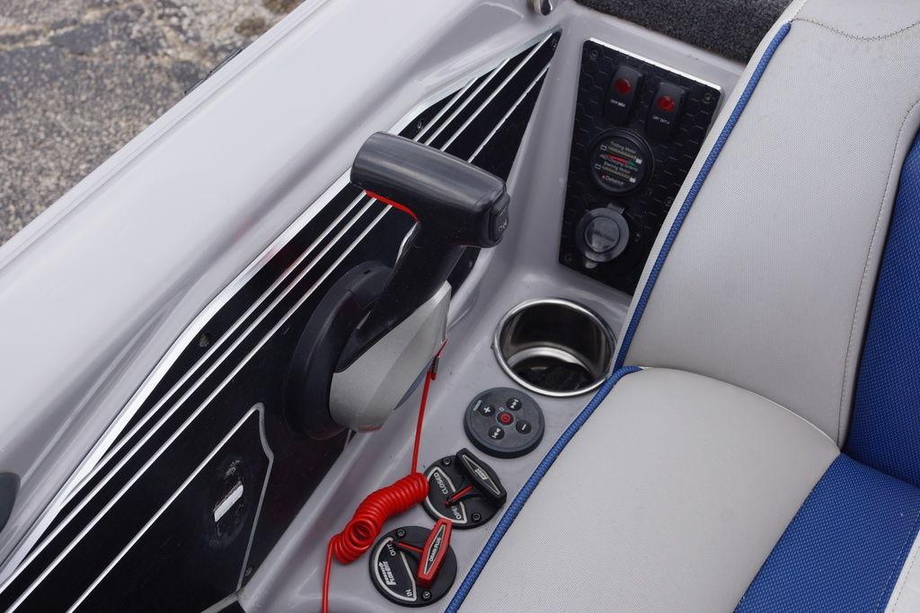 2020 Skeeter FXR21 Limited boat console with controls and cup holder.