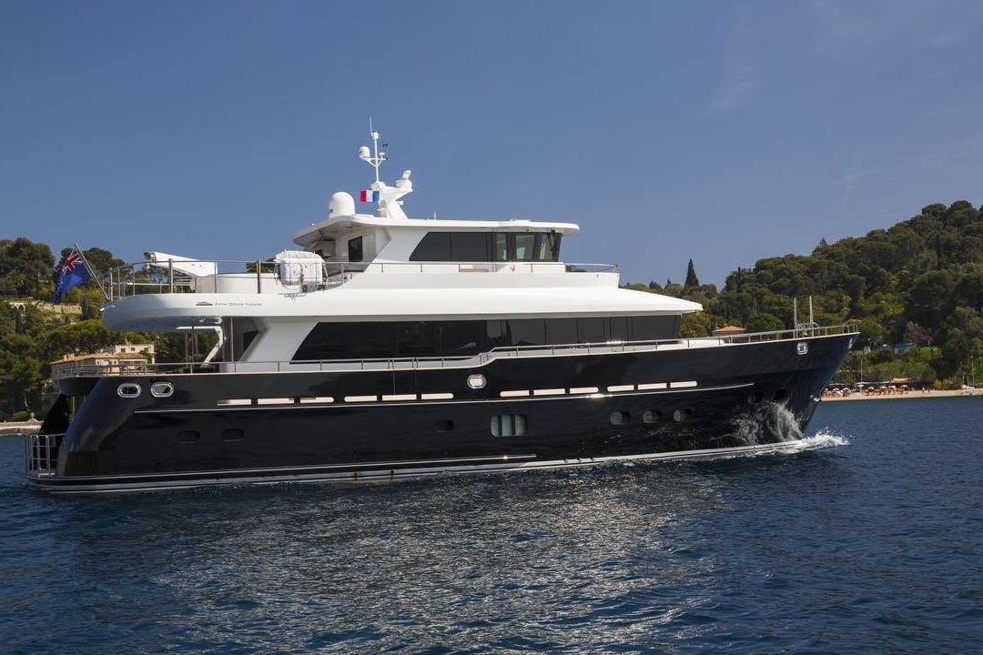 Fifth Ocean Yachts 24m Displacement Explorer Yacht, 2014, cruising near a scenic coastline.